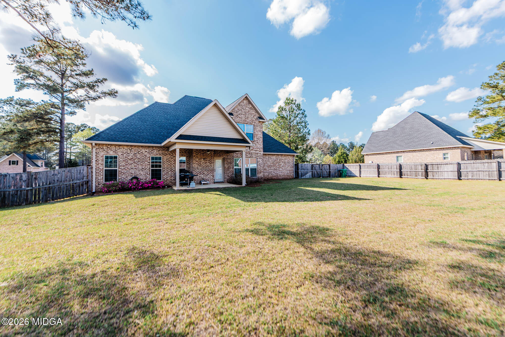112 Bainbridge Lane Perry, GA 31069 - Photo 5 of 37 a front view of a house with a big yard