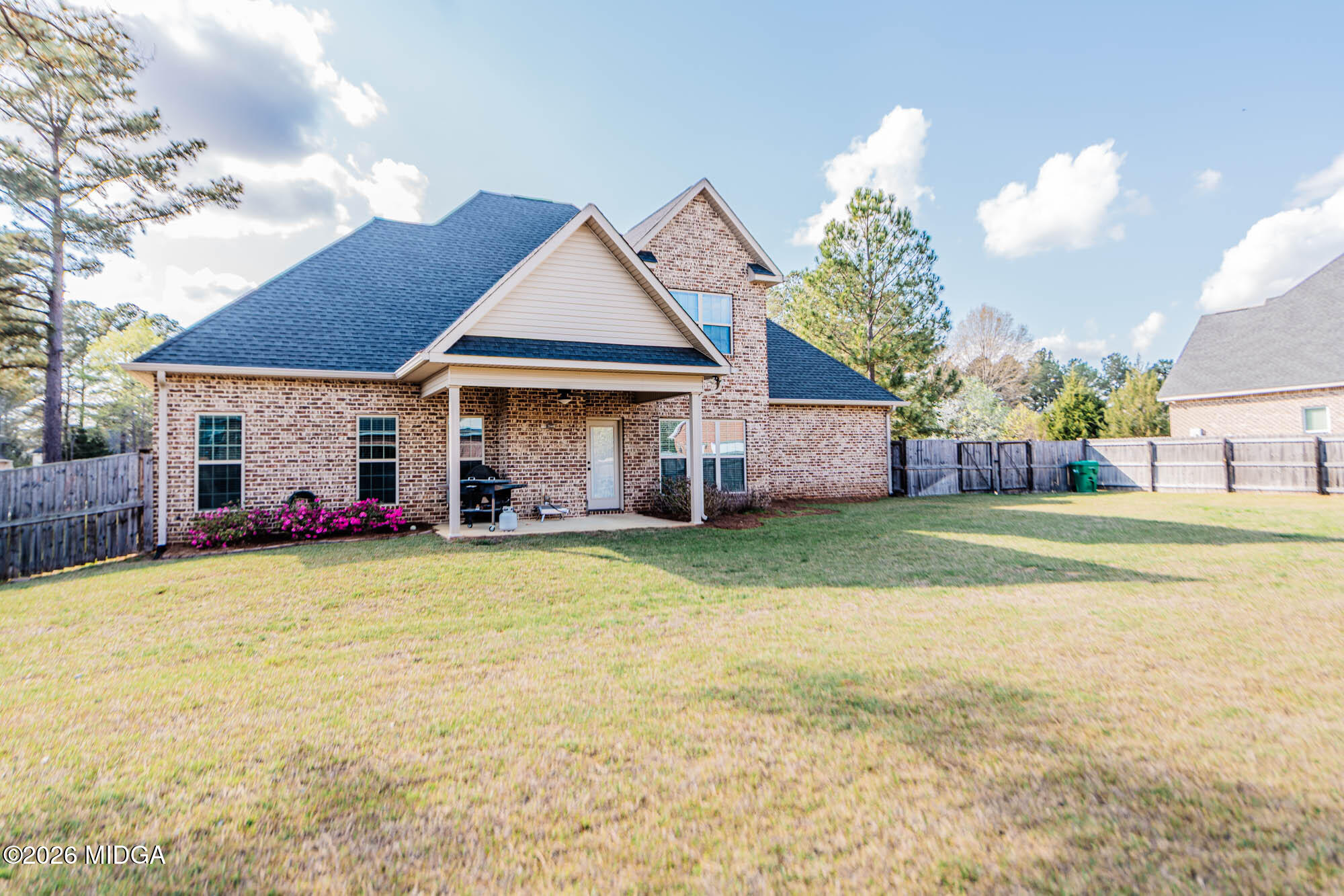 112 Bainbridge Lane Perry, GA 31069 - Photo 6 of 37 a front view of a house with a garden and deck