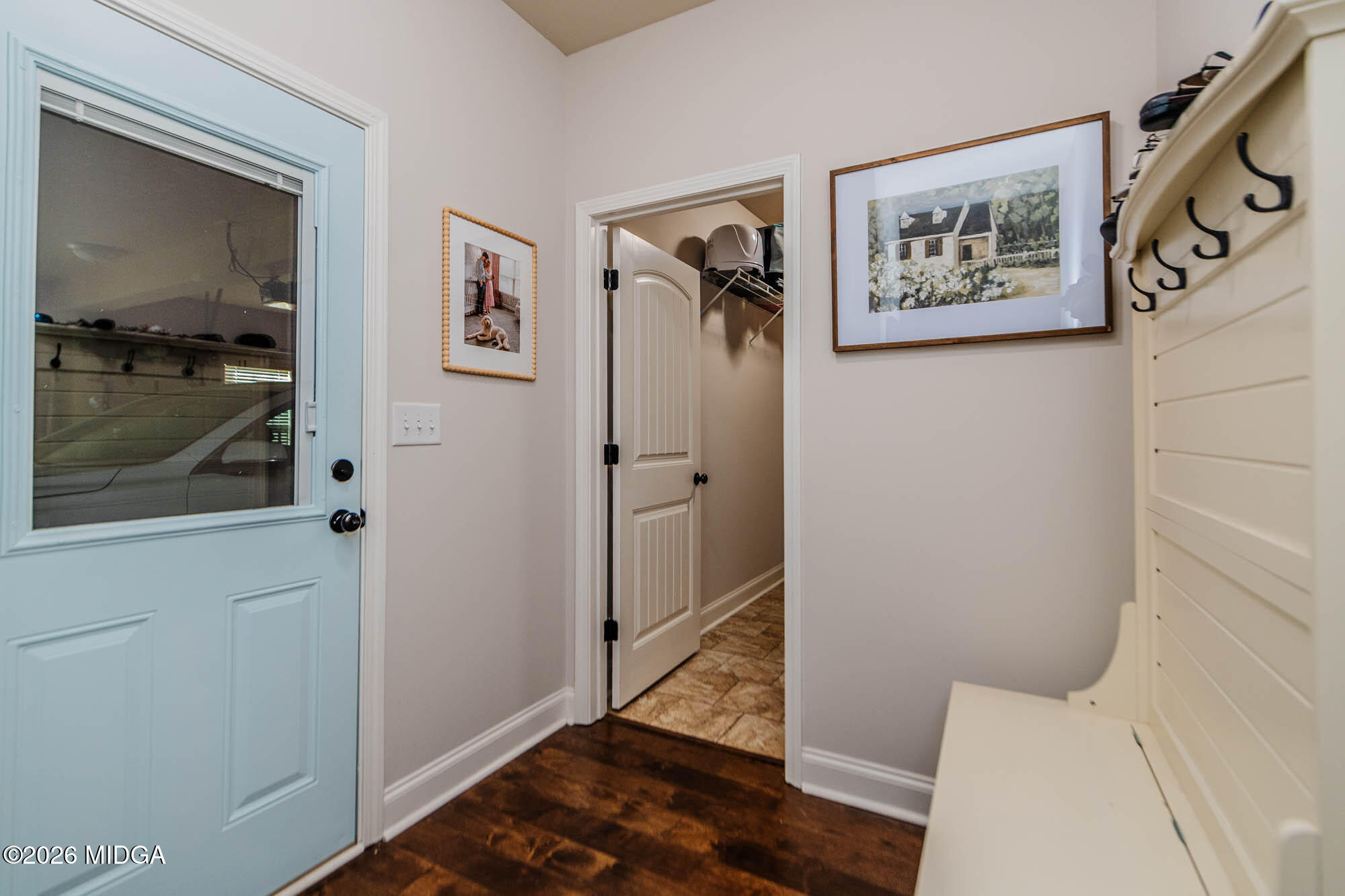 112 Bainbridge Lane Perry, GA 31069 - Photo 8 of 37 a view of a hallway with paintings on the wall