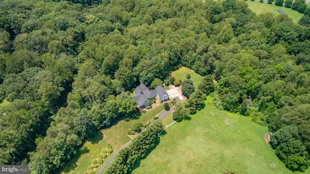 a kitchen with stainless steel appliances granite countertop a stove and cabinets