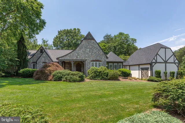 a house that has a tree in front of it