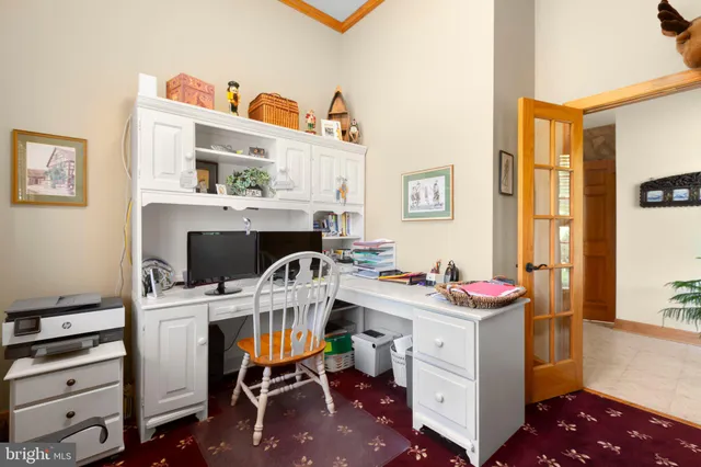 a living room with furniture a chandelier furniture and a large window