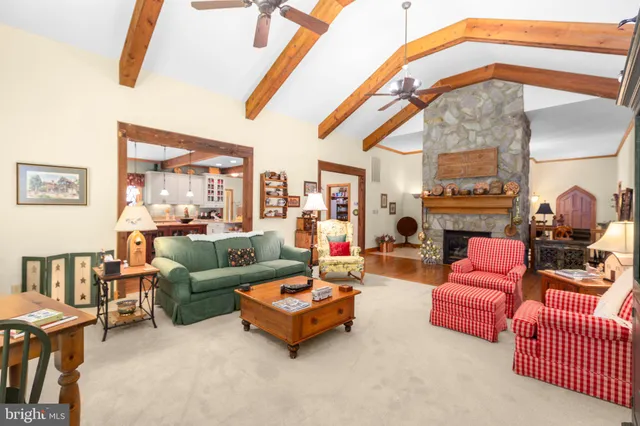 a view of a livingroom with furniture flat screen tv and wooden floor