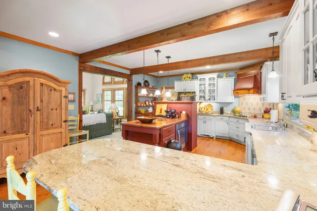 a bedroom with bed and a chandelier