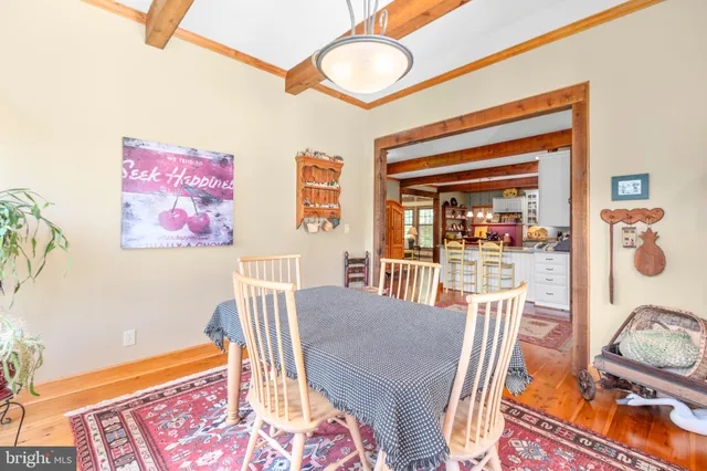 a view of a field of grass and trees