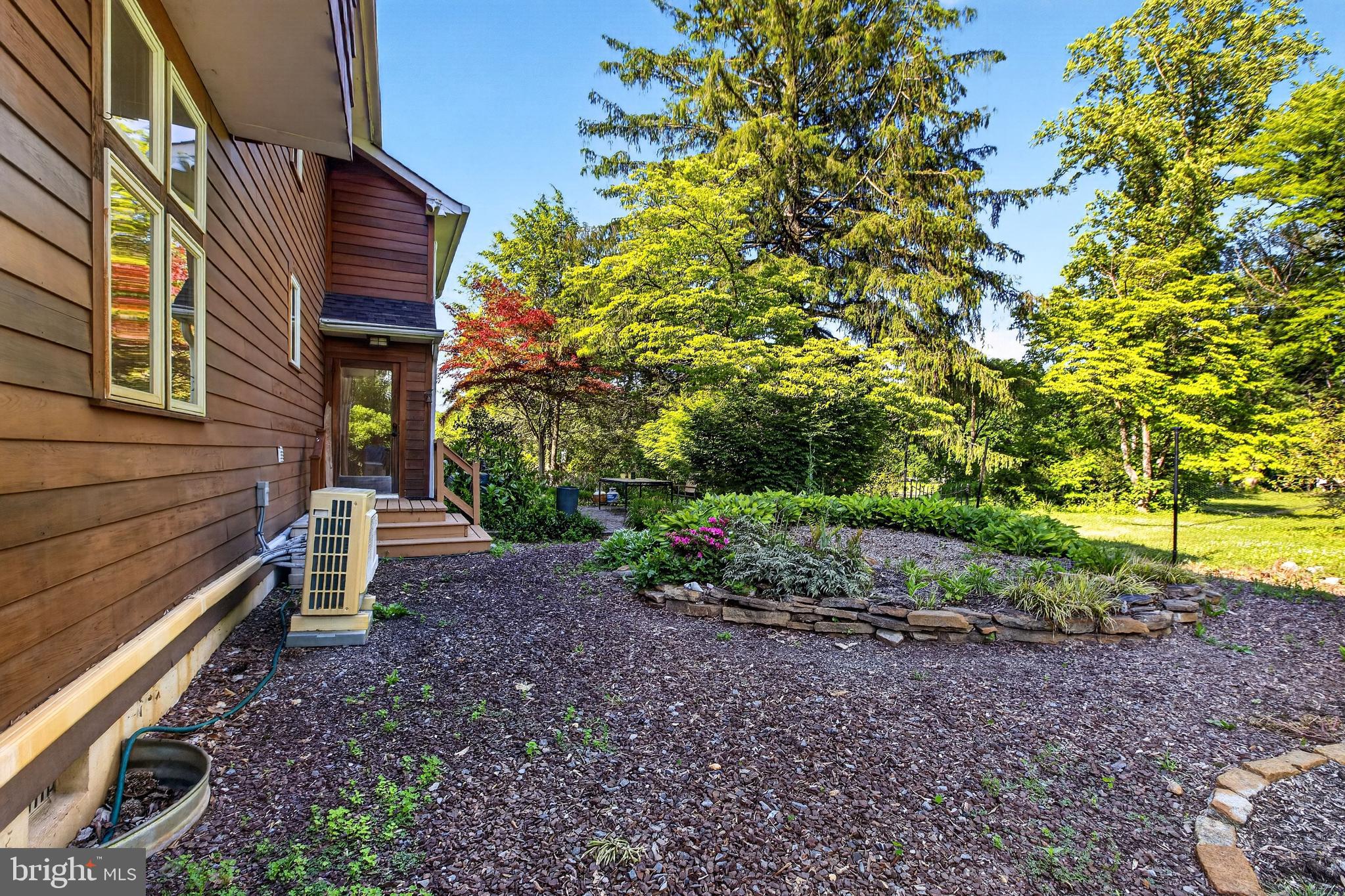 498 Perrineville Road Robbinsville, NJ 08691 - Photo 56 of 59 a view of a backyard that has plants and large tree