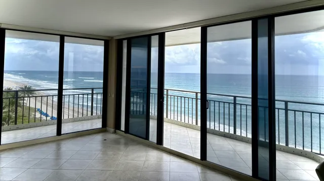 a view of an empty room with a large window