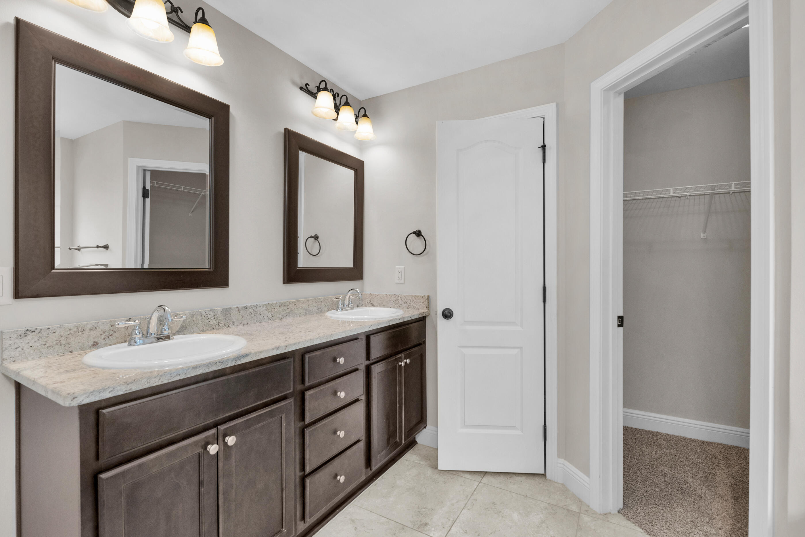 118 Trailwood Lane Crestview, FL 32539 - Photo 20 of 32 a bathroom with a double vanity sink and a mirror