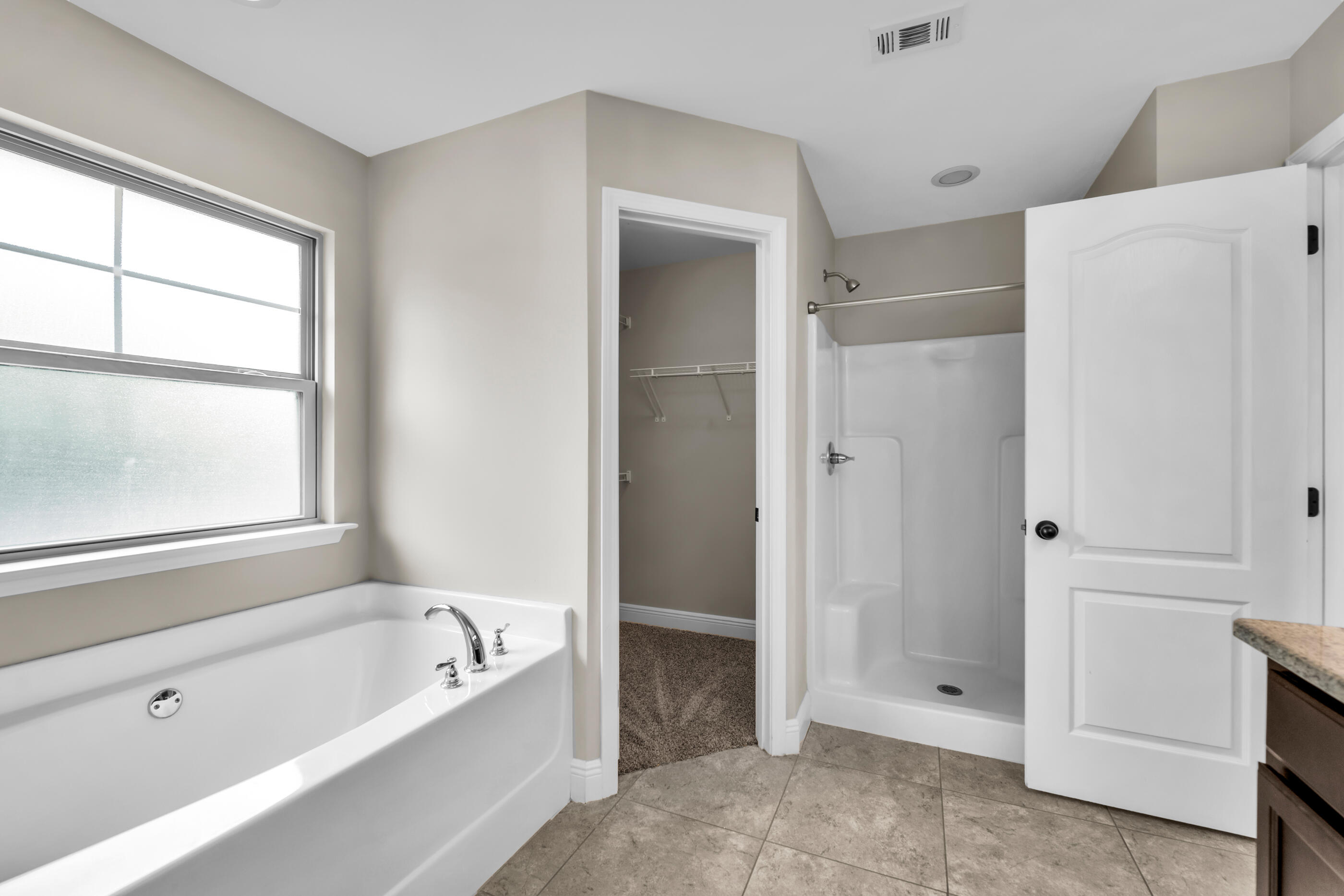 118 Trailwood Lane Crestview, FL 32539 - Photo 21 of 32 a bathroom with a bathtub and a shower