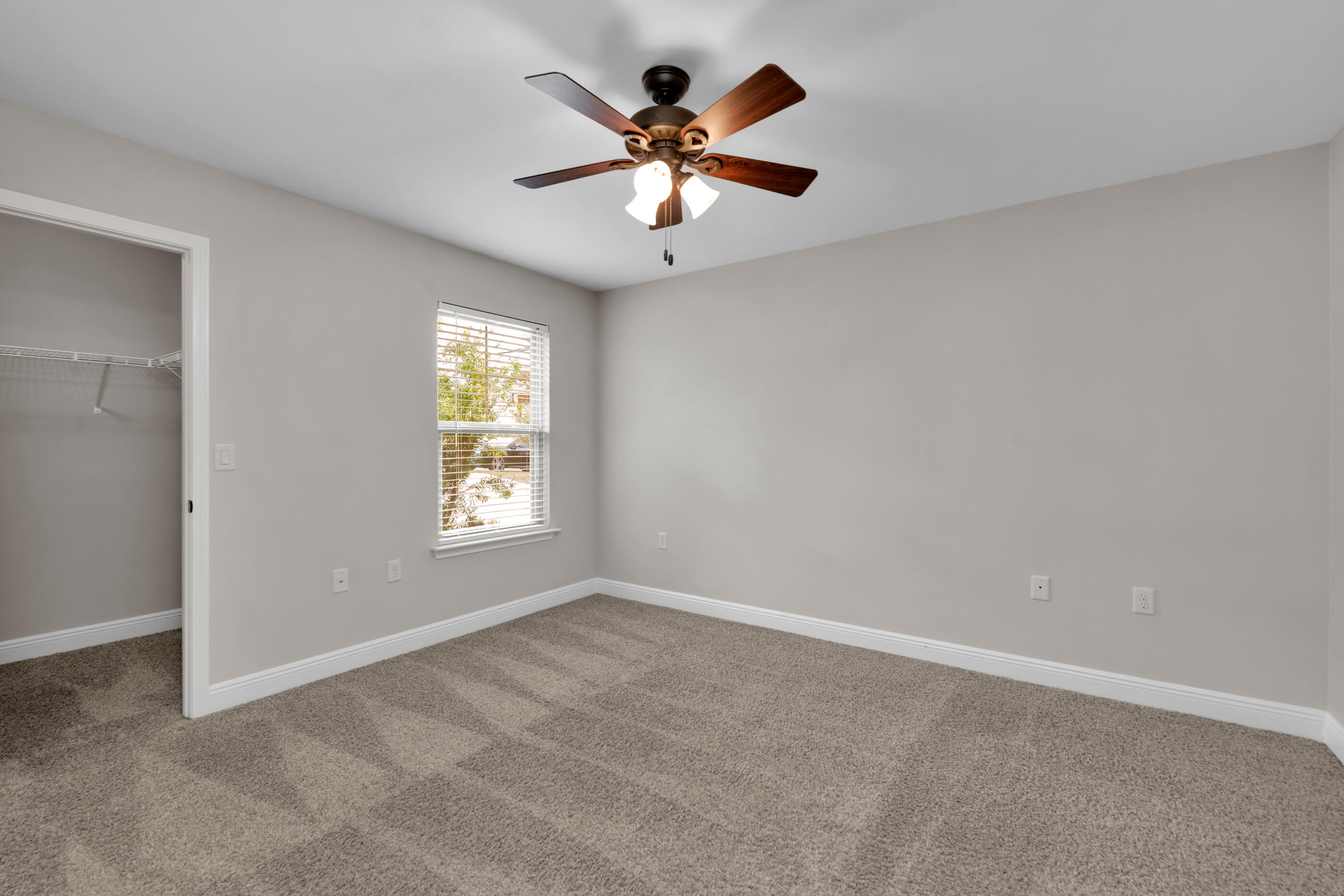 118 Trailwood Lane Crestview, FL 32539 - Photo 23 of 32 a view of an empty room with window and ceiling fan