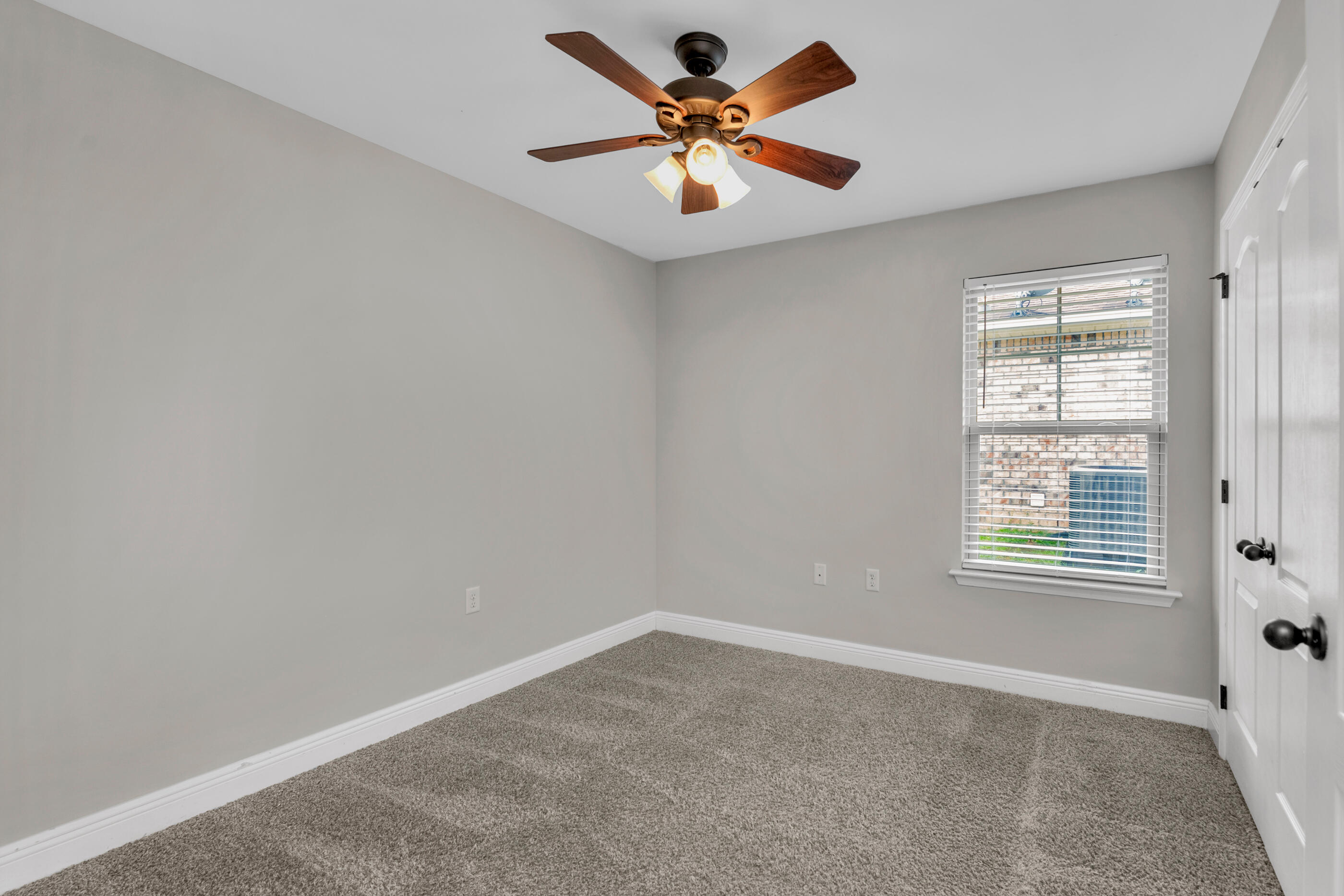 118 Trailwood Lane Crestview, FL 32539 - Photo 24 of 32 an empty room with a window and a fan