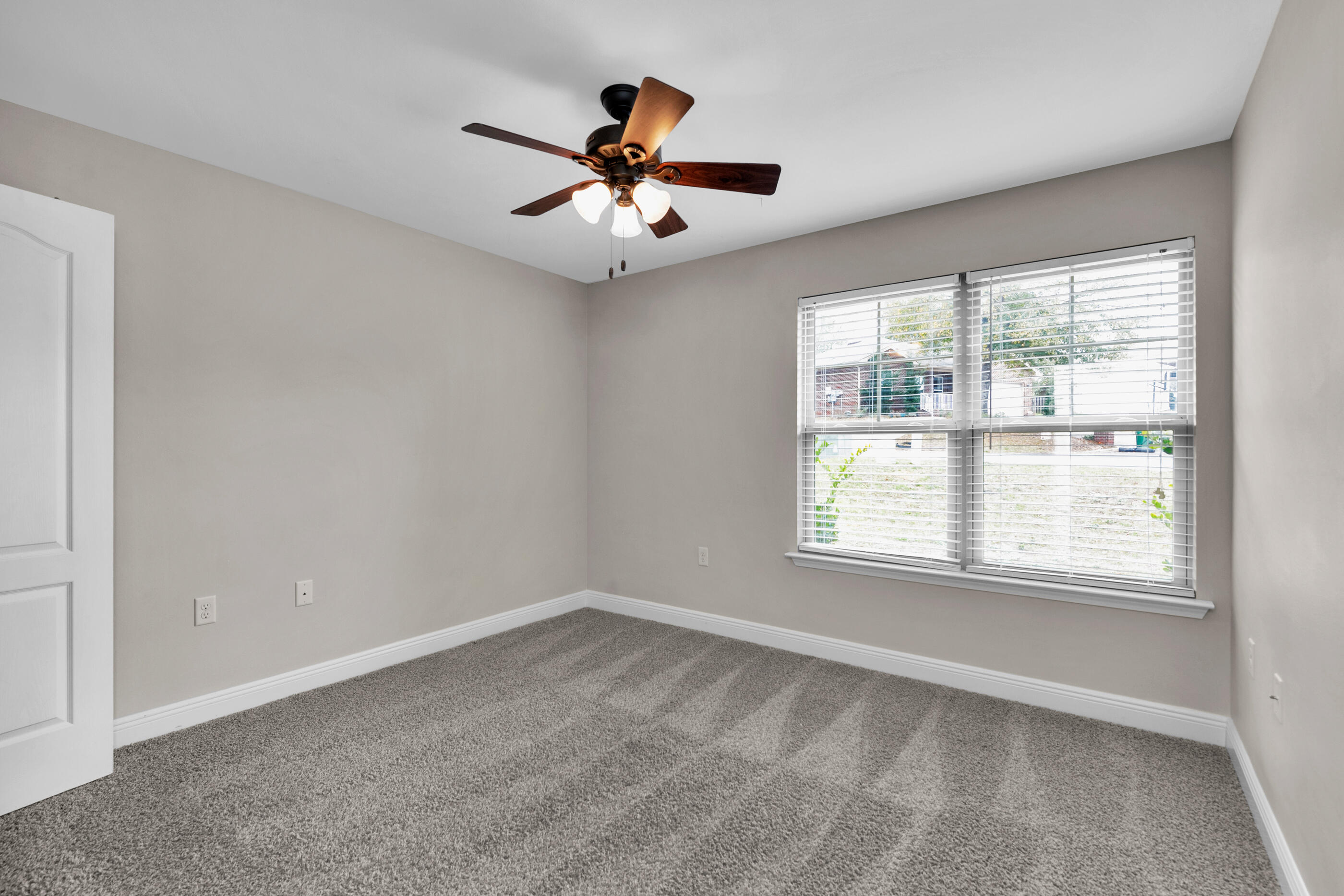 118 Trailwood Lane Crestview, FL 32539 - Photo 25 of 32 wooden floor in an empty room with a window