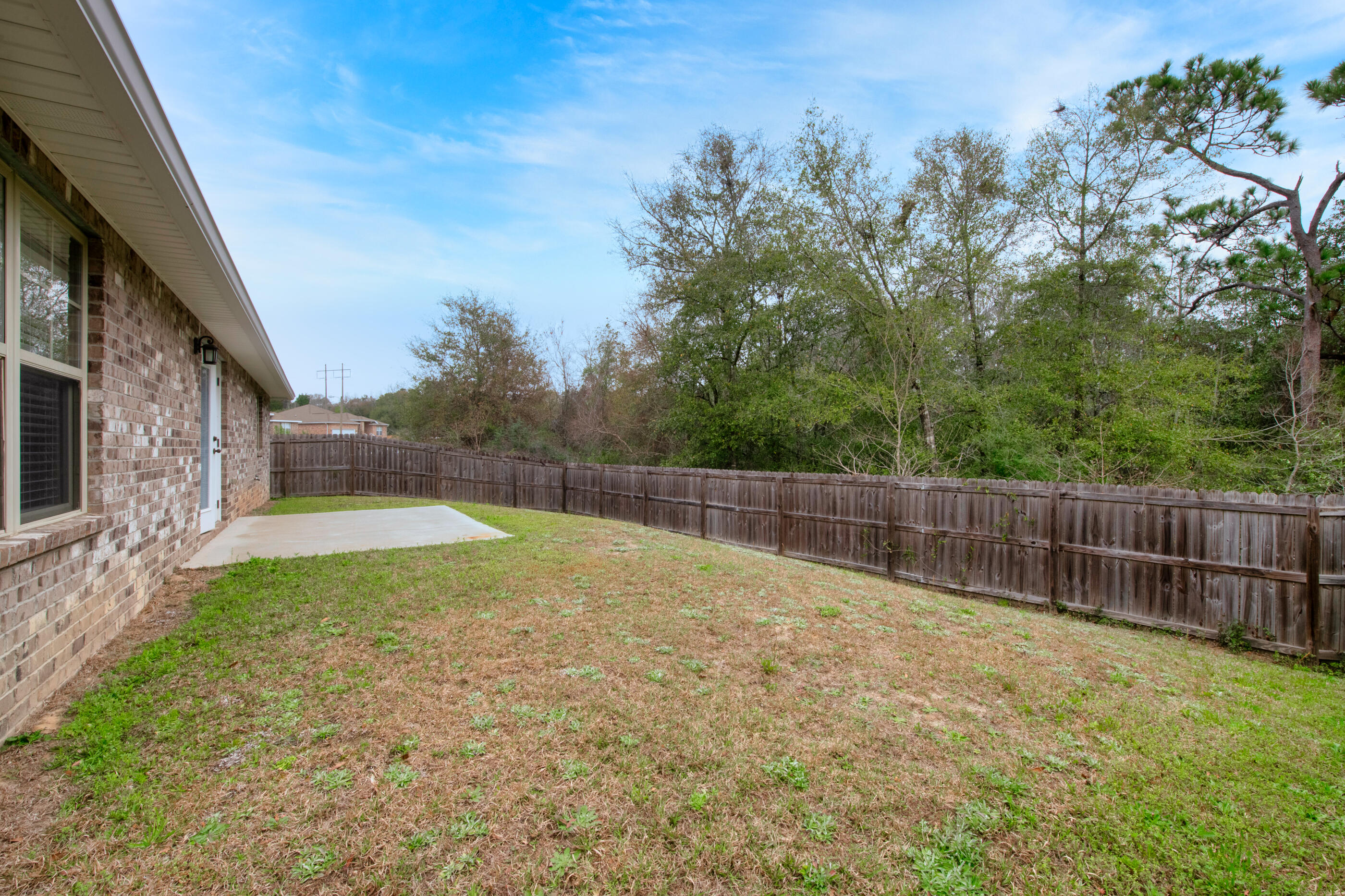 118 Trailwood Lane Crestview, FL 32539 - Photo 27 of 32 a view of backyard with wooden fence