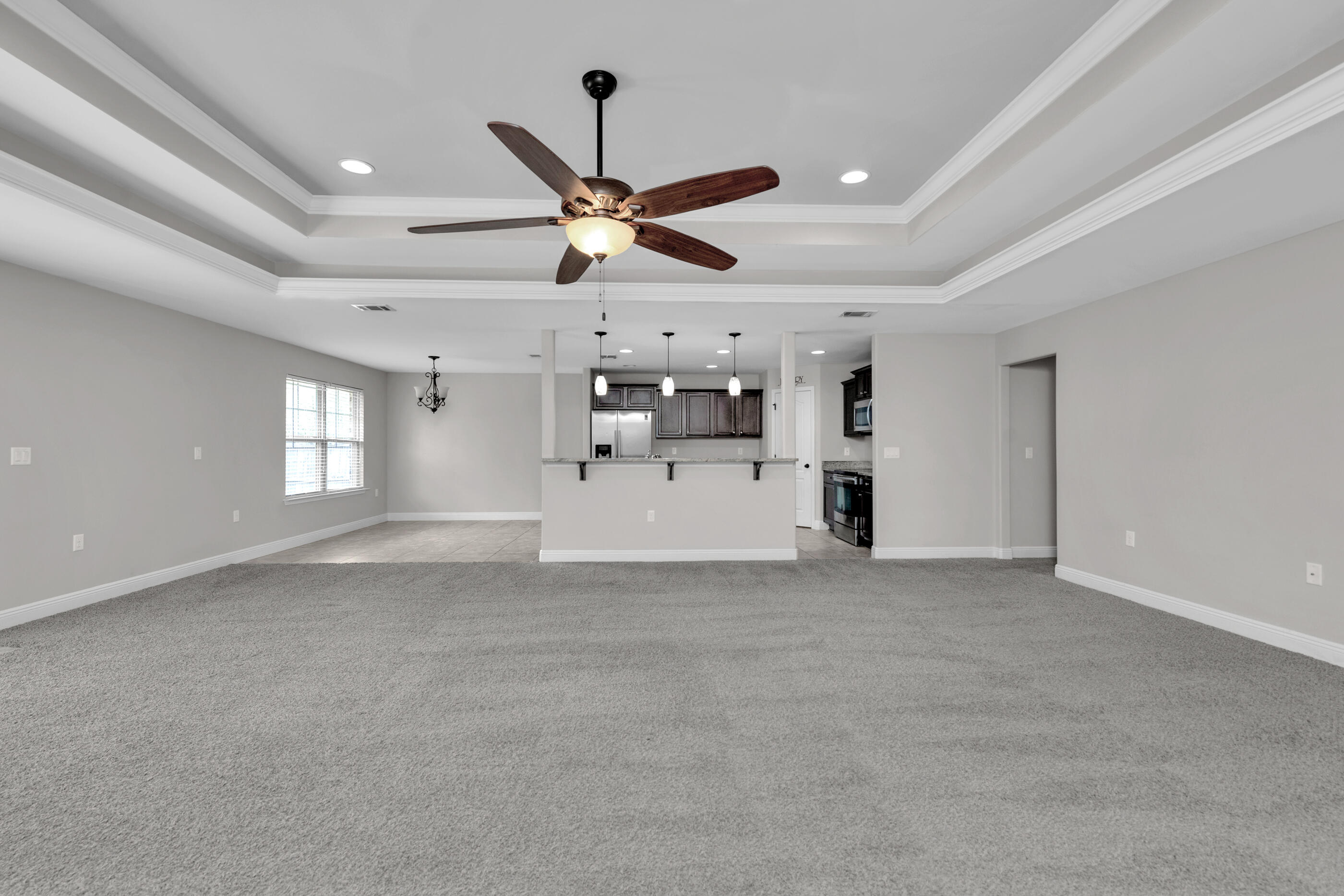 118 Trailwood Lane Crestview, FL 32539 - Photo 4 of 32 a view of a livingroom with a ceiling fan and window