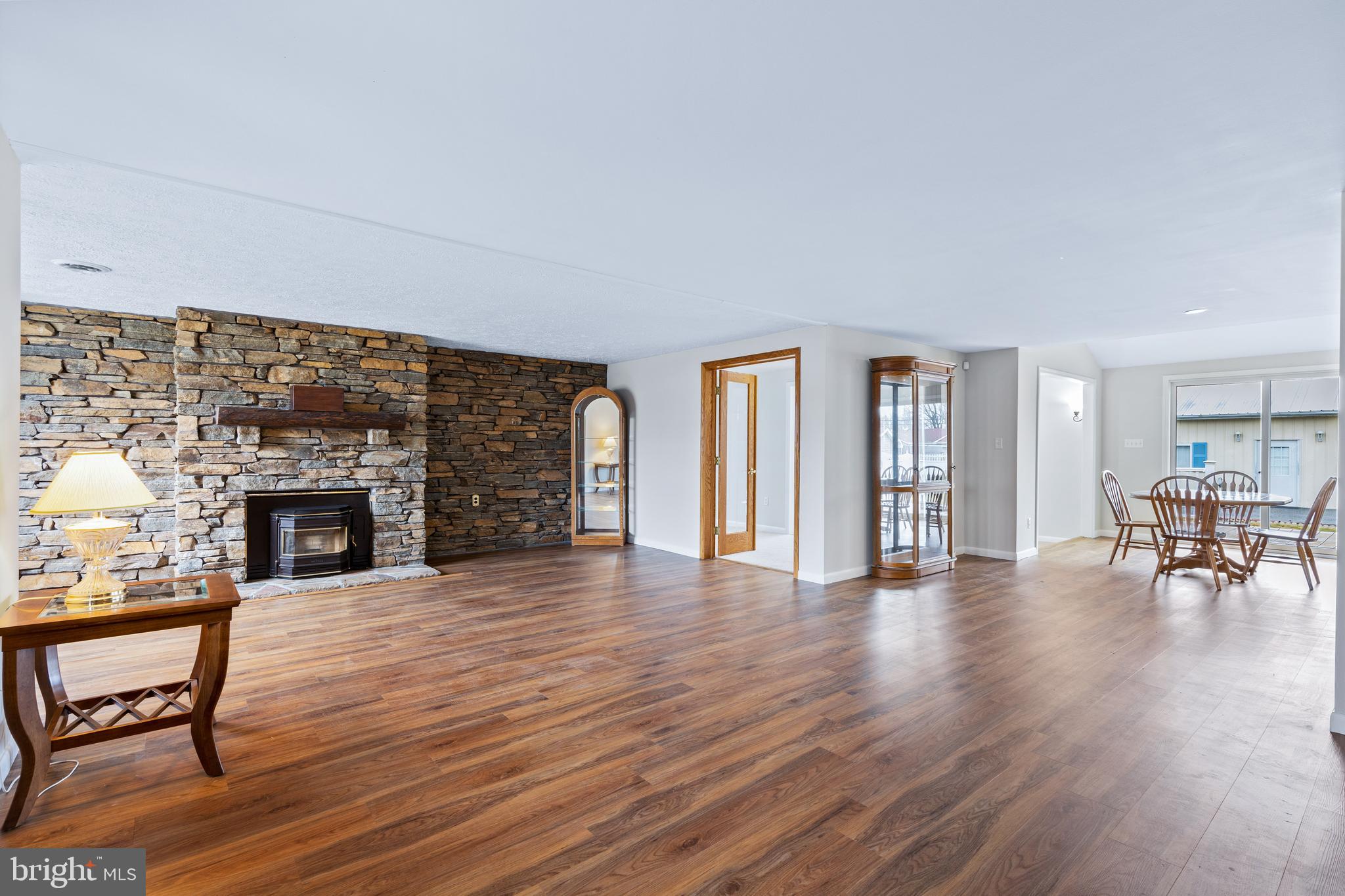 2304 Maple Road Baltimore, MD 21219 - Photo 7 of 61 Living room with french doors & pellet stove