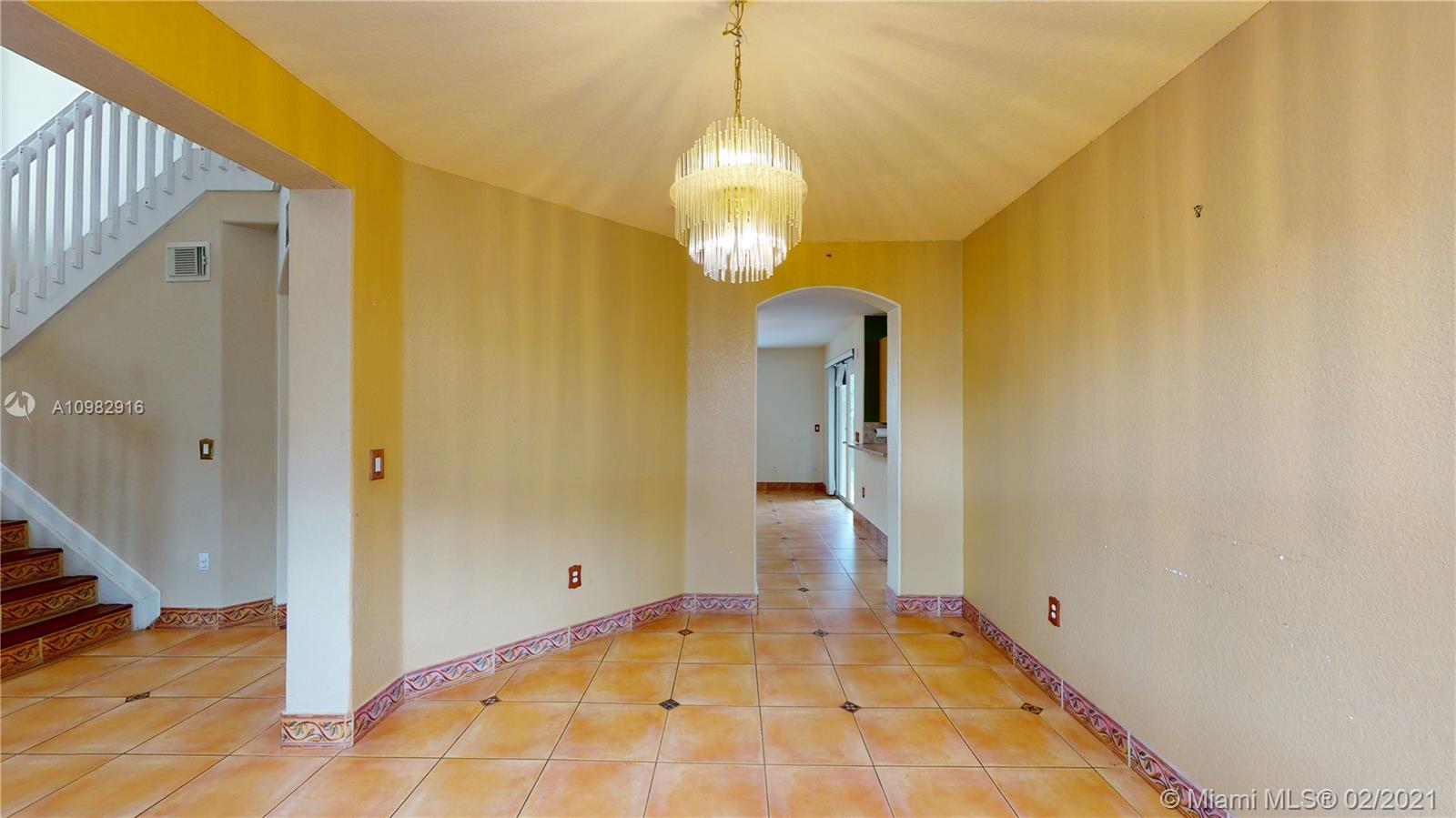 12355 Southwest 124th Terrace Miami, FL 33186 - Photo 11 of 61 a view of empty room with wooden floor and fan