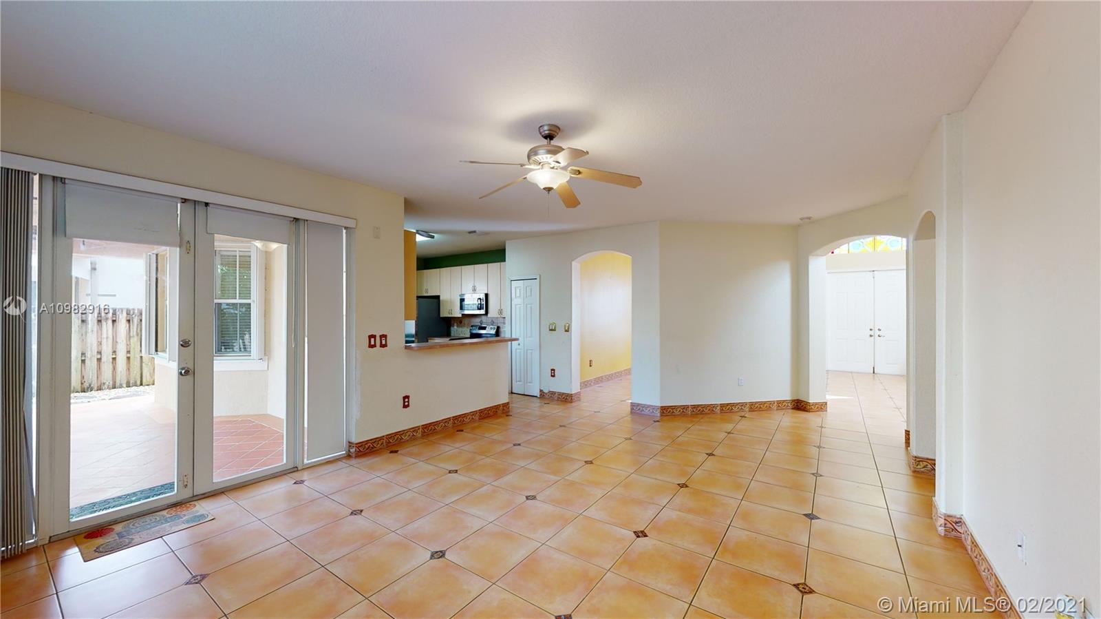 12355 Southwest 124th Terrace Miami, FL 33186 - Photo 15 of 61 a view of a kitchen with refrigerator and a stove top oven