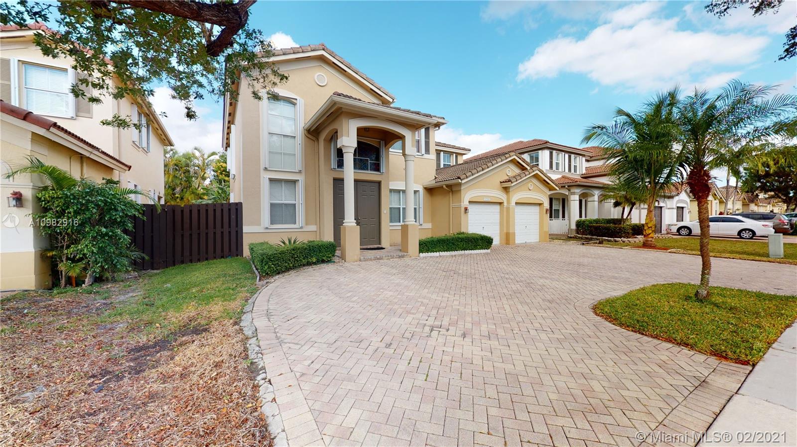 12355 Southwest 124th Terrace Miami, FL 33186 - Photo 3 of 61 a front view of a house with a yard and garage