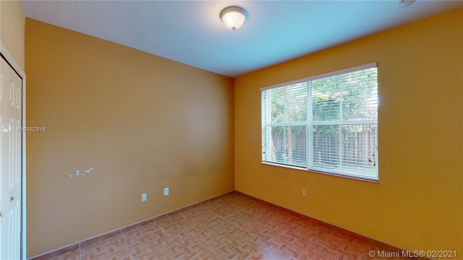 12355 Southwest 124th Terrace Miami, FL 33186 - Photo 31 of 61 a view of an empty room with a window