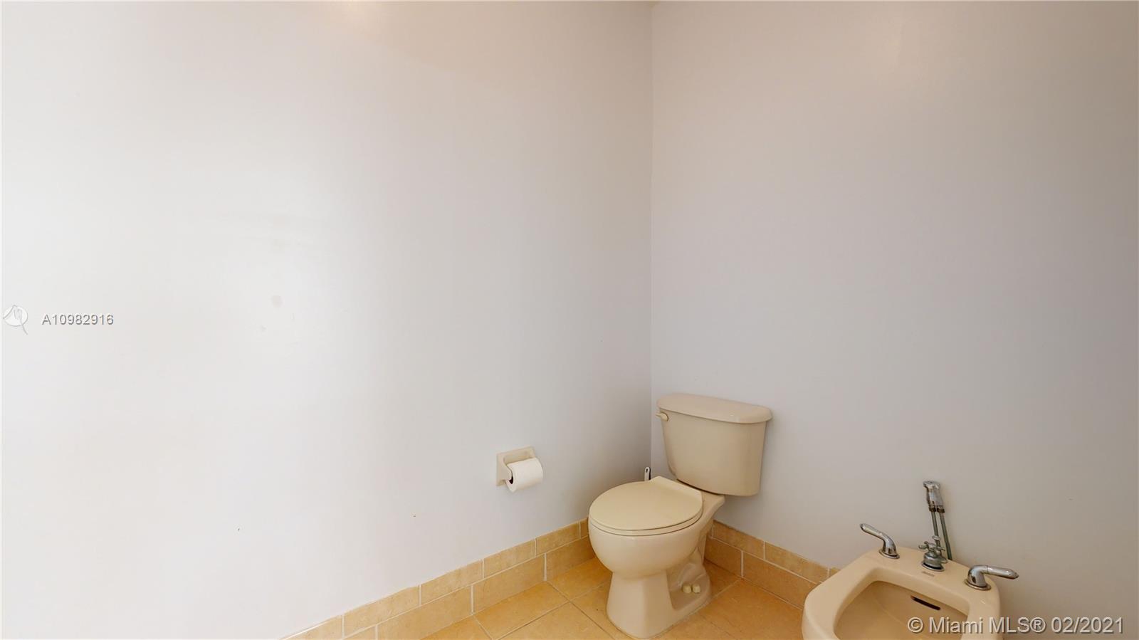 12355 Southwest 124th Terrace Miami, FL 33186 - Photo 43 of 61 a white toilet sitting next to a white wall