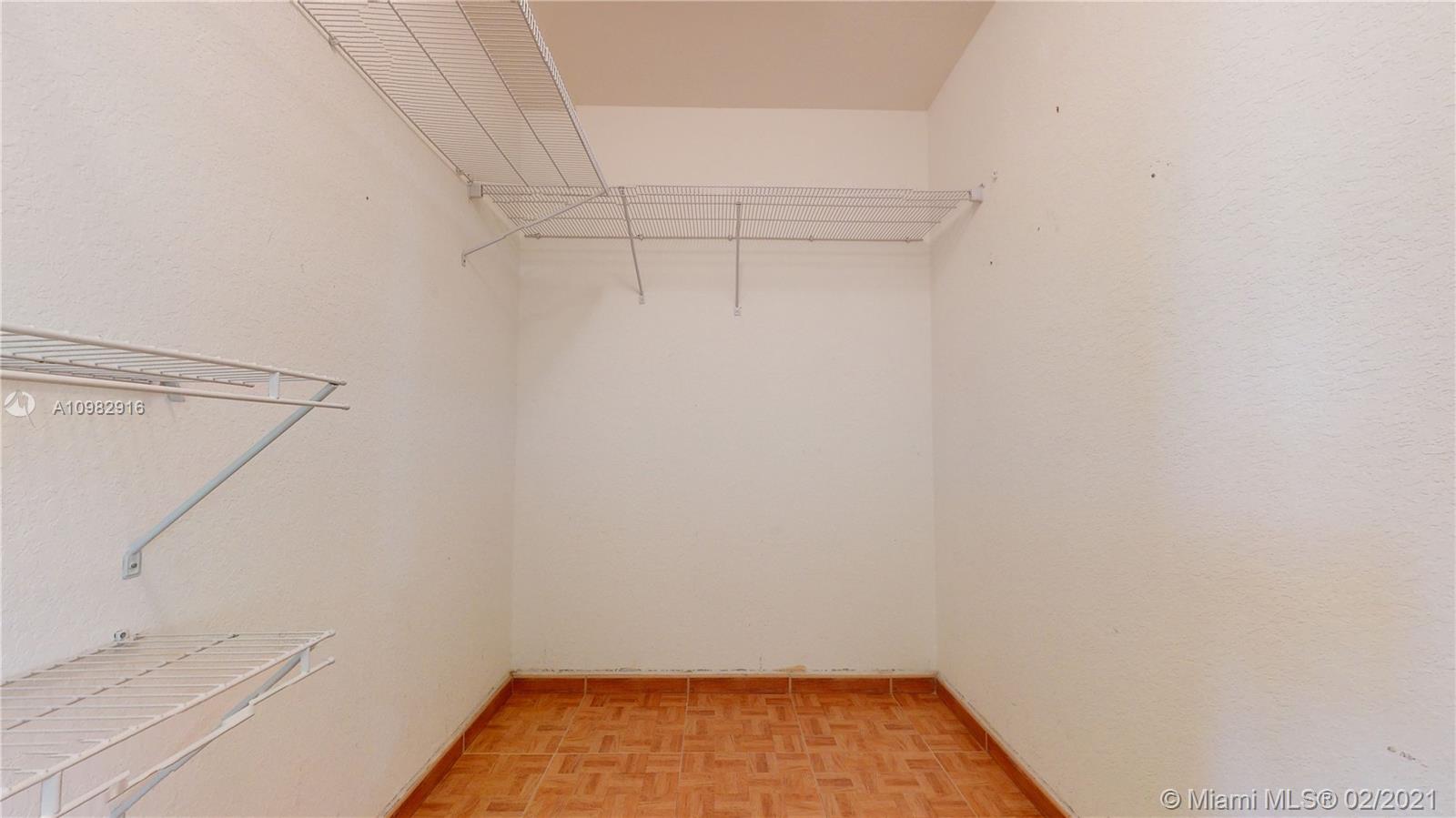 12355 Southwest 124th Terrace Miami, FL 33186 - Photo 45 of 61 a view of small space with racks on the wall