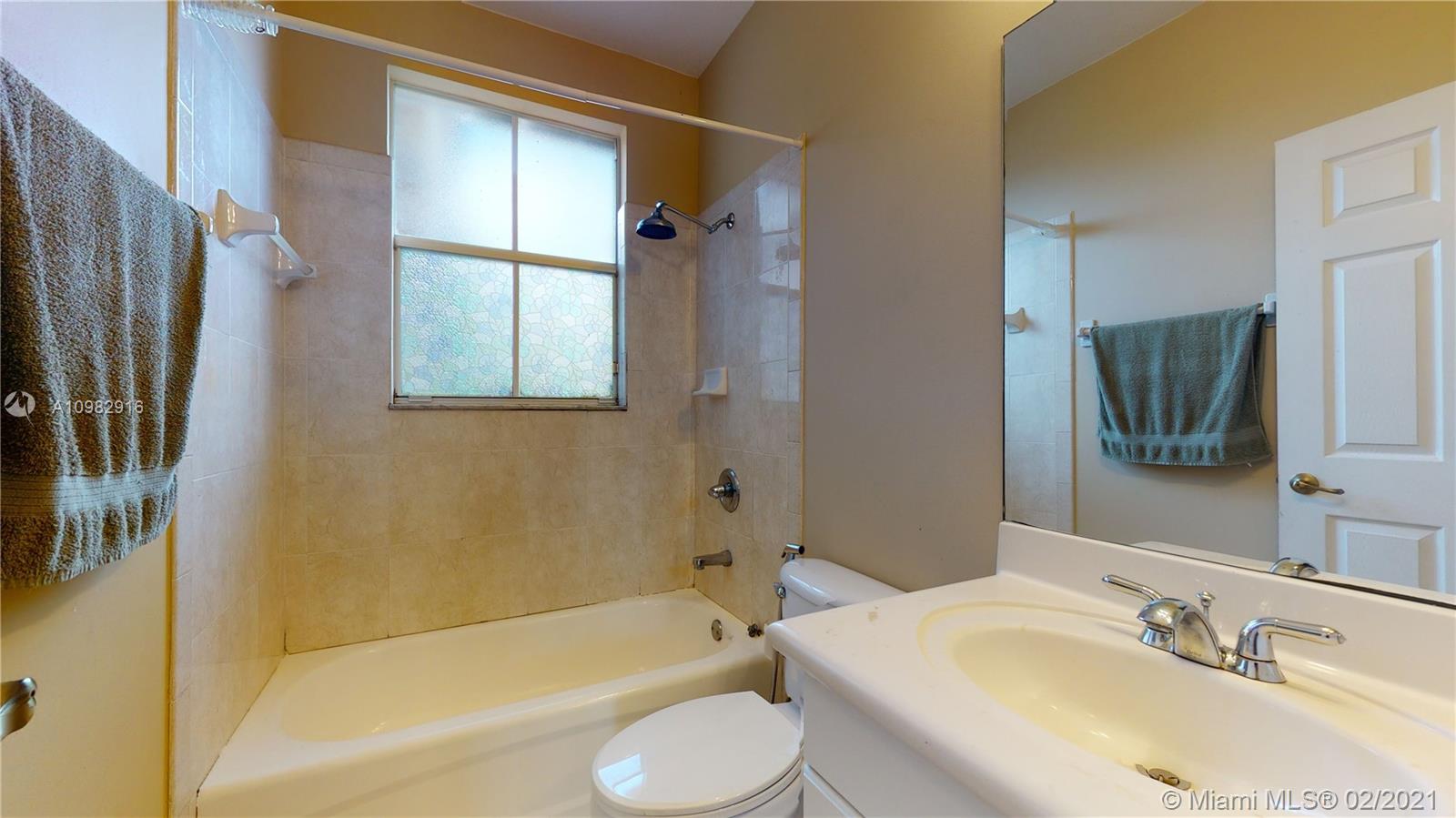 12355 Southwest 124th Terrace Miami, FL 33186 - Photo 49 of 61 a bathroom with a sink toilet and shower
