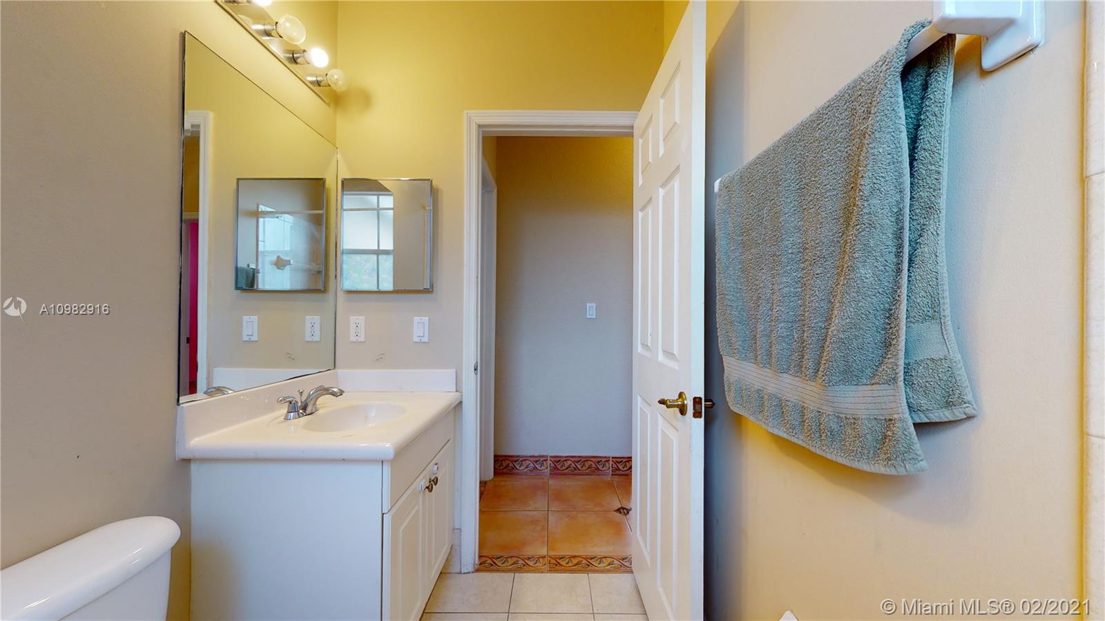 12355 Southwest 124th Terrace Miami, FL 33186 - Photo 50 of 61 a bathroom with a tub sink and mirror