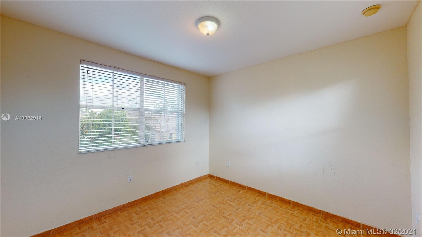 12355 Southwest 124th Terrace Miami, FL 33186 - Photo 51 of 61 an empty room with a window