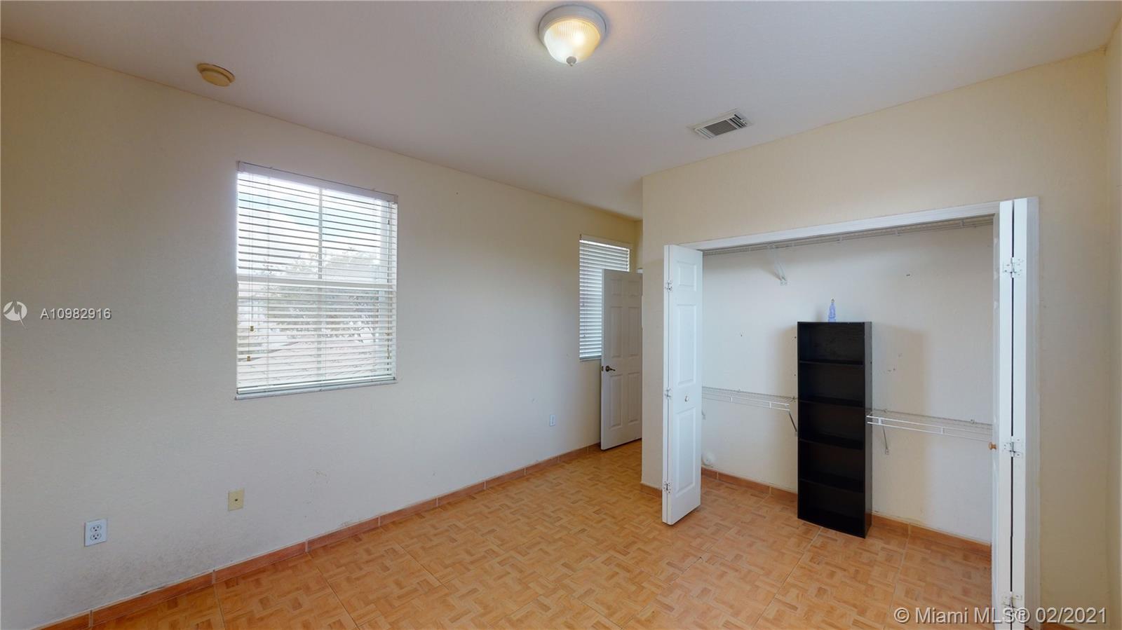 12355 Southwest 124th Terrace Miami, FL 33186 - Photo 53 of 61 a view of an empty room with closet and a window