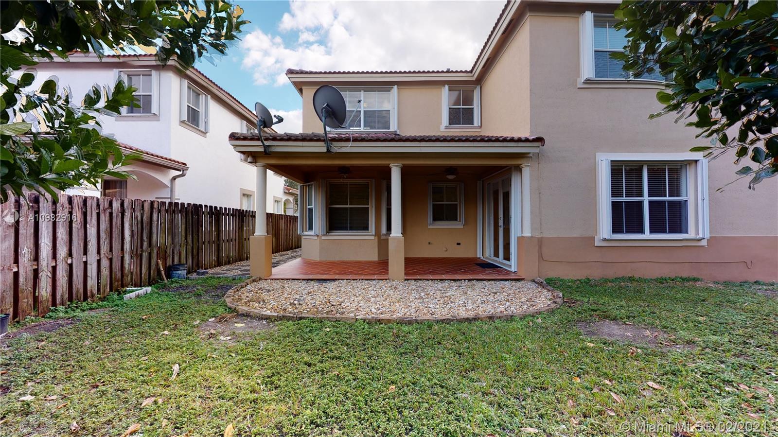 12355 Southwest 124th Terrace Miami, FL 33186 - Photo 55 of 61 a front view of a house with garden
