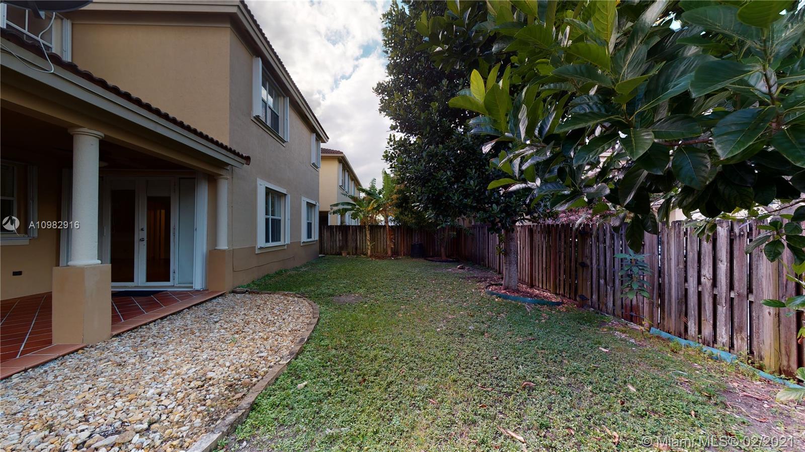 12355 Southwest 124th Terrace Miami, FL 33186 - Photo 56 of 61 a view of a house with a yard
