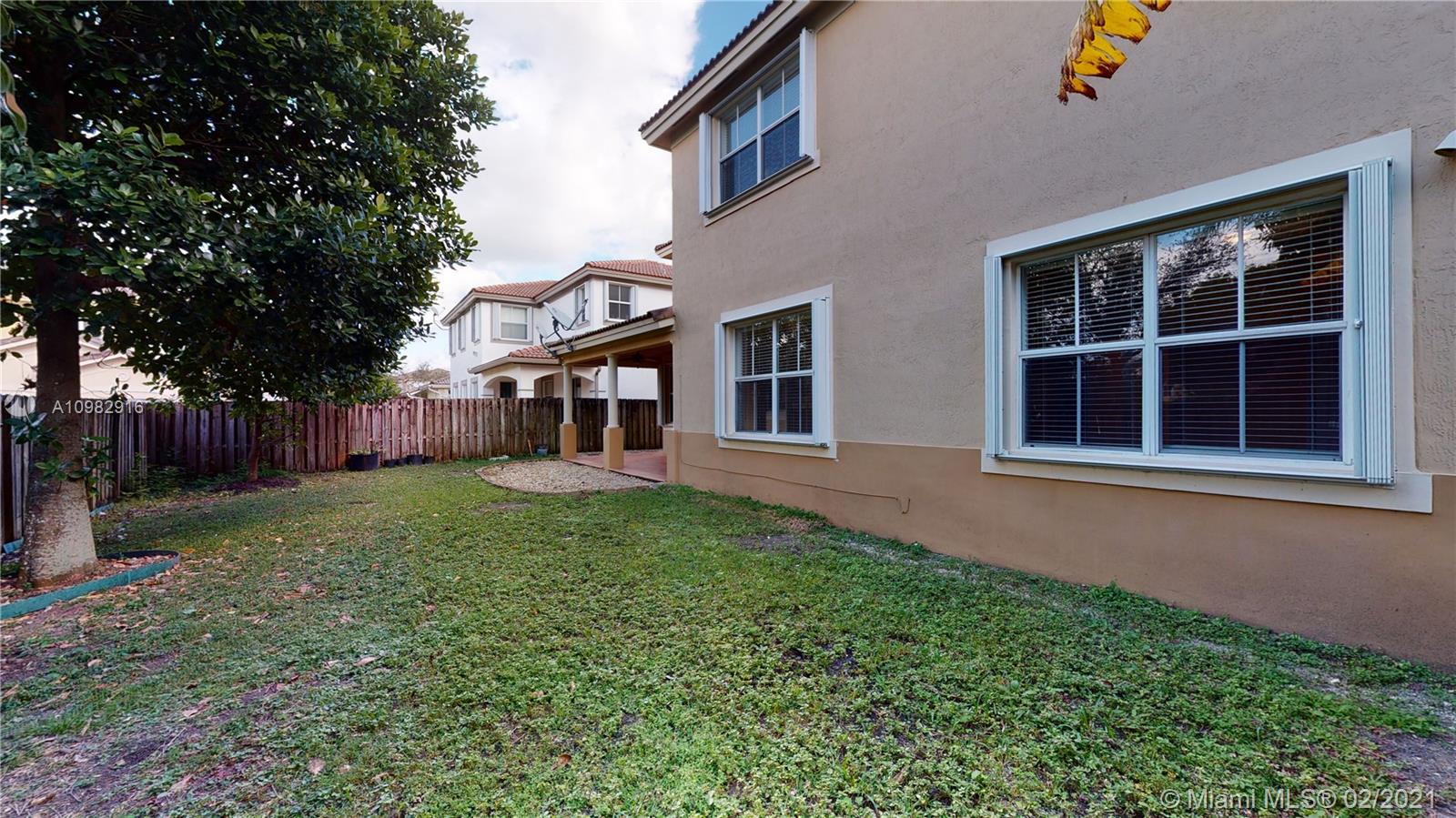 12355 Southwest 124th Terrace Miami, FL 33186 - Photo 57 of 61 a view of a house with backyard and garden