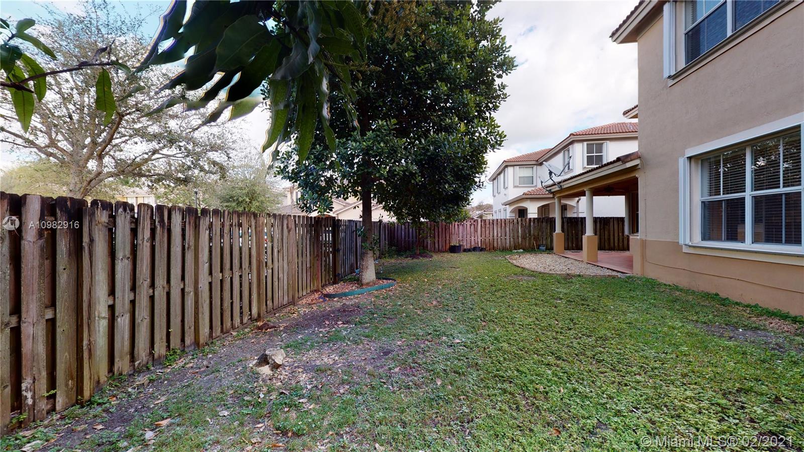 12355 Southwest 124th Terrace Miami, FL 33186 - Photo 58 of 61 a view of a house with backyard and porch