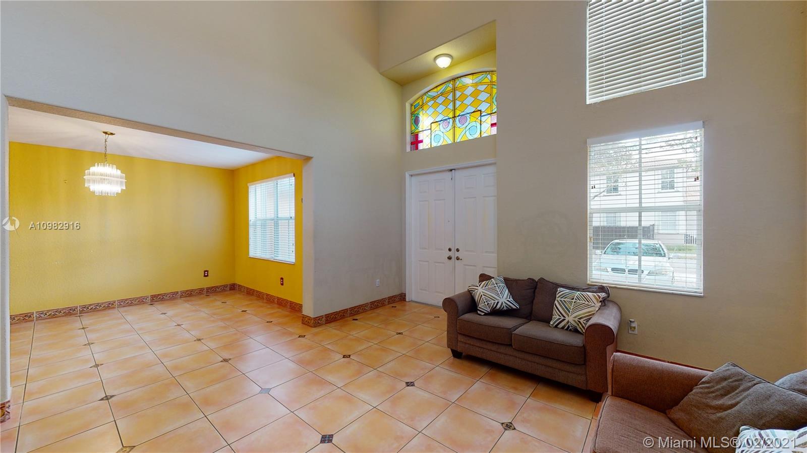 12355 Southwest 124th Terrace Miami, FL 33186 - Photo 7 of 61 a living room with furniture and window
