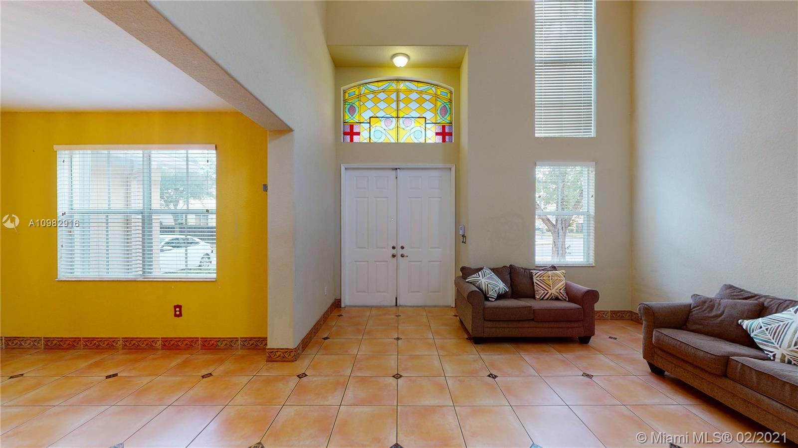 12355 Southwest 124th Terrace Miami, FL 33186 - Photo 8 of 61 a living room with furniture and a window
