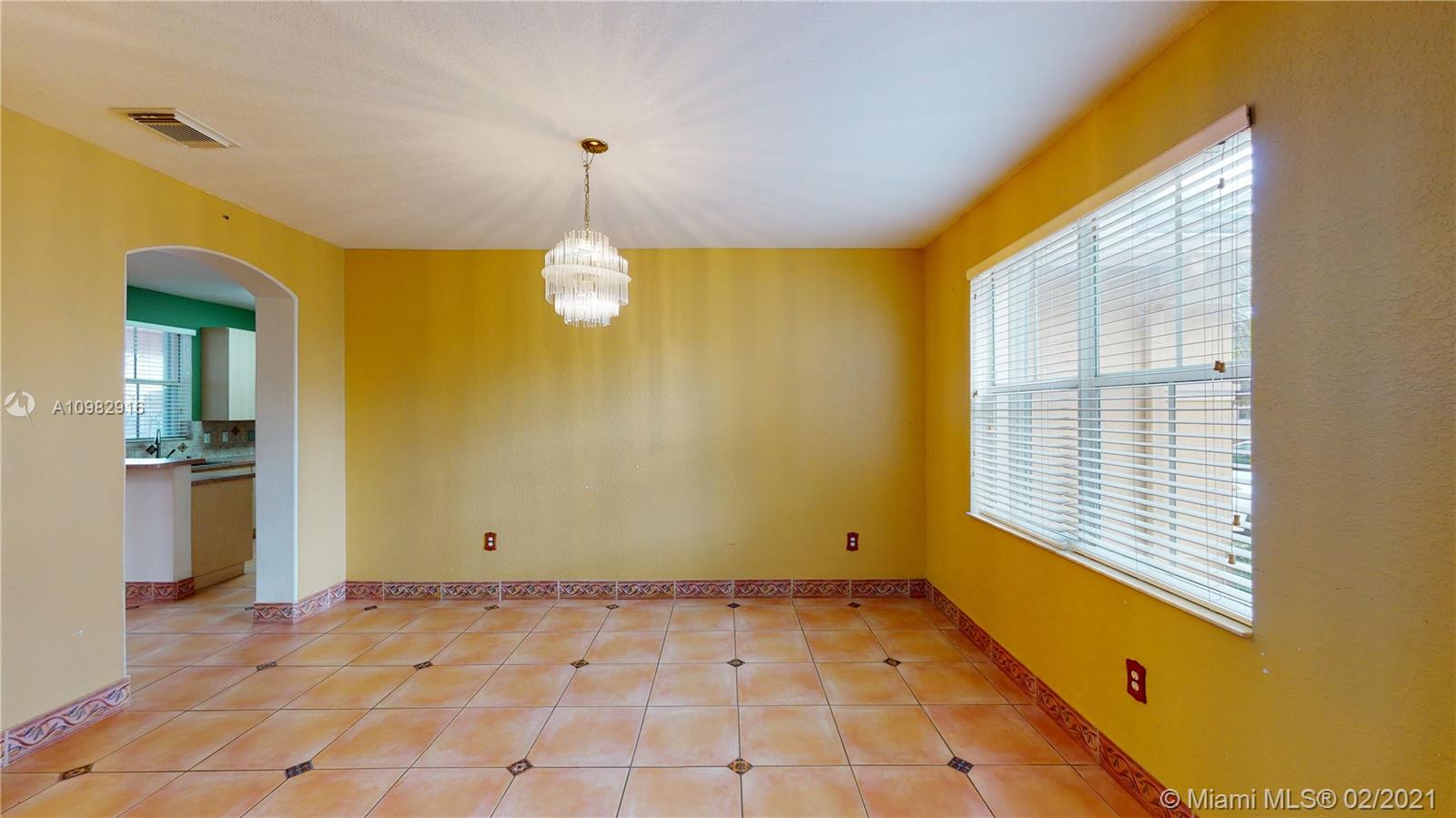 12355 Southwest 124th Terrace Miami, FL 33186 - Photo 10 of 61 a view of an empty room with a window