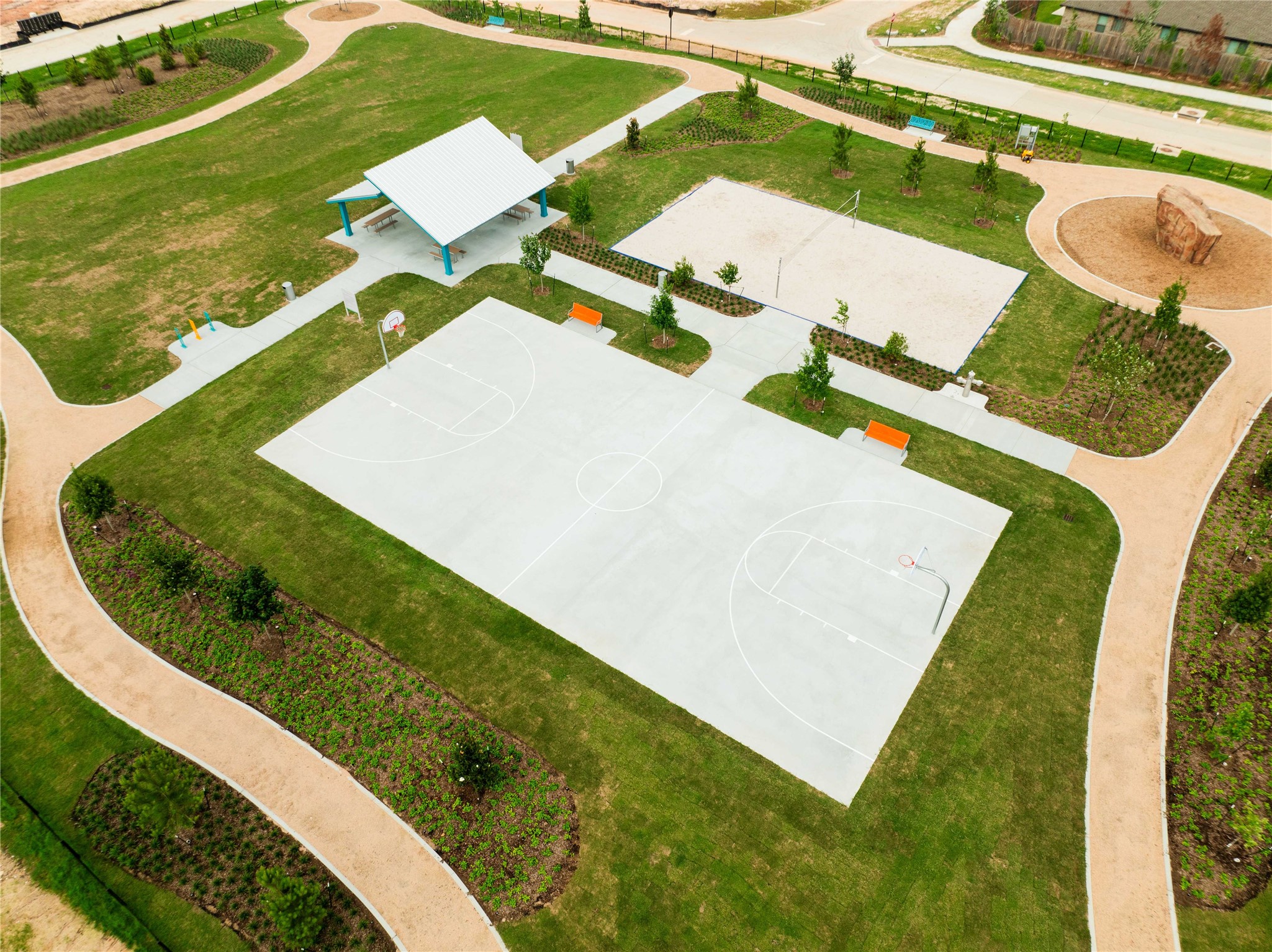 403 Venado View Court Conroe, TX 77304 - Photo 36 of 39 Volleyball and basketball courts in the Grand Central Park community.