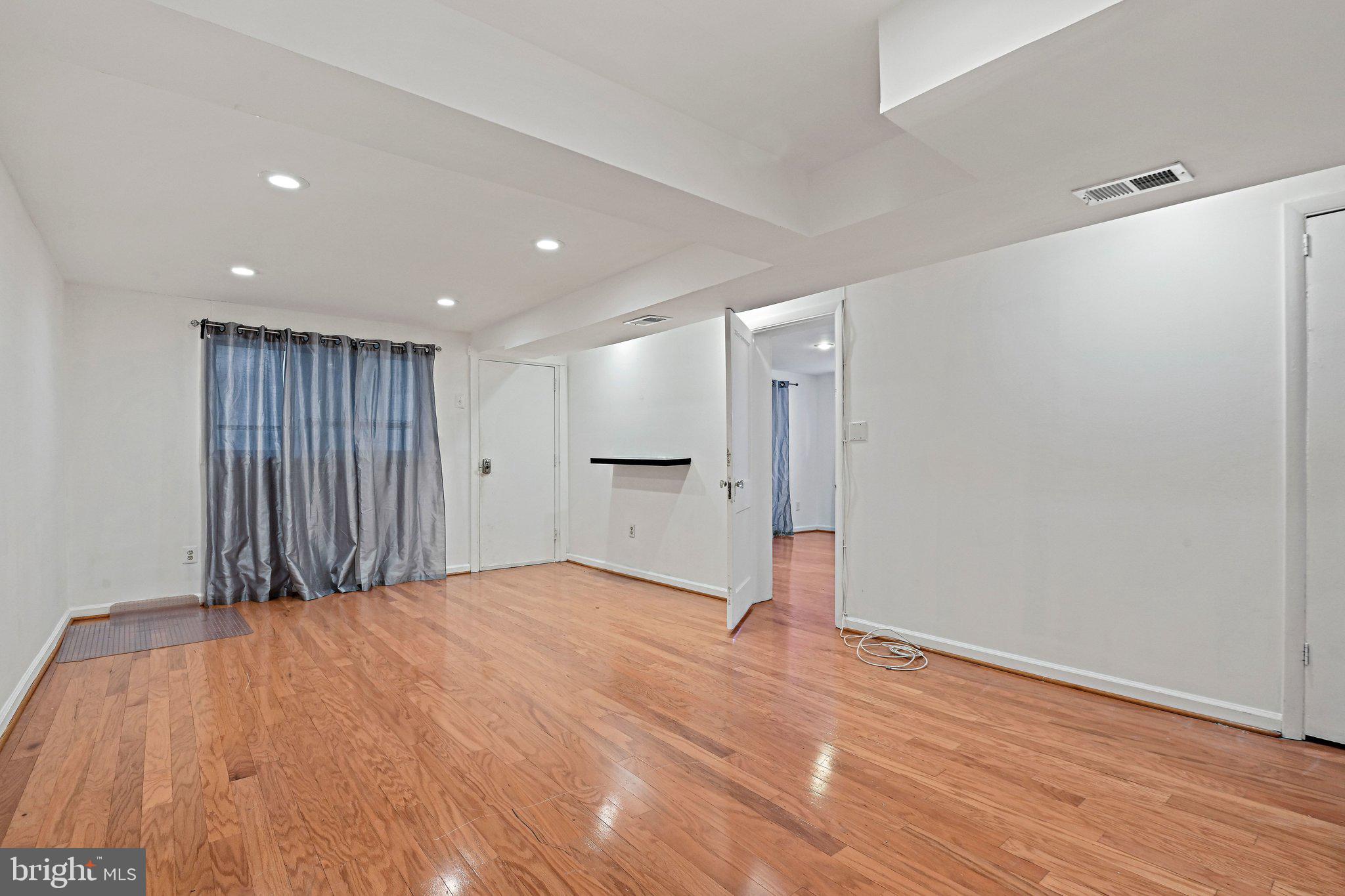 6713 Old Chesterbrook Road McLean, VA 22101 - Photo 14 of 38 a view of an empty room with wooden floor