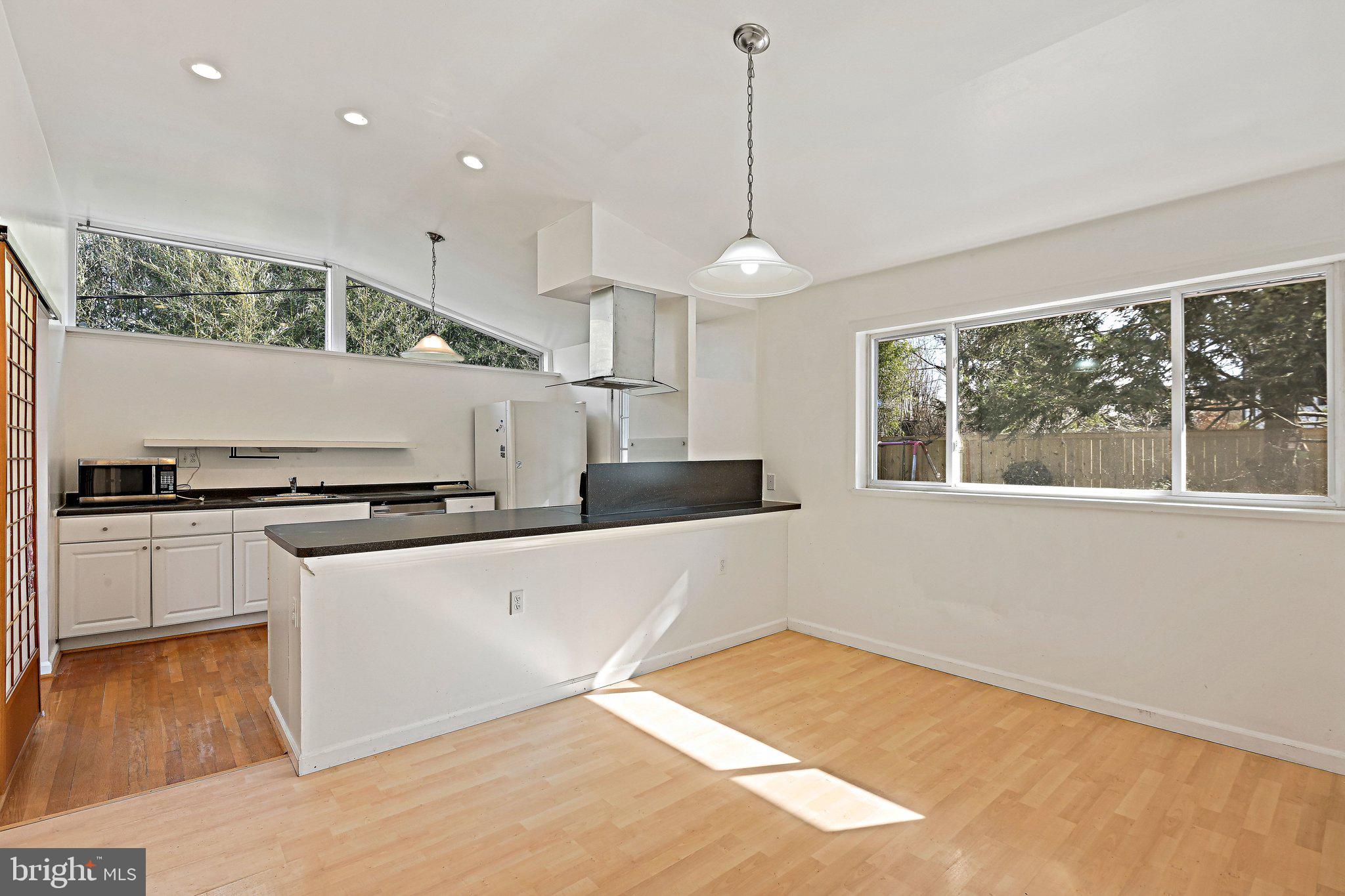 6713 Old Chesterbrook Road McLean, VA 22101 - Photo 20 of 38 a kitchen with stainless steel appliances granite countertop a sink a stove and a refrigerator