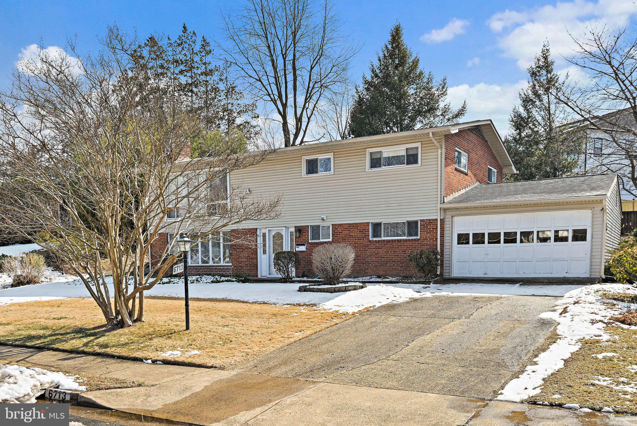 6713 Old Chesterbrook Road McLean, VA 22101 - Photo 2 of 38 a view of a house with snow on the road