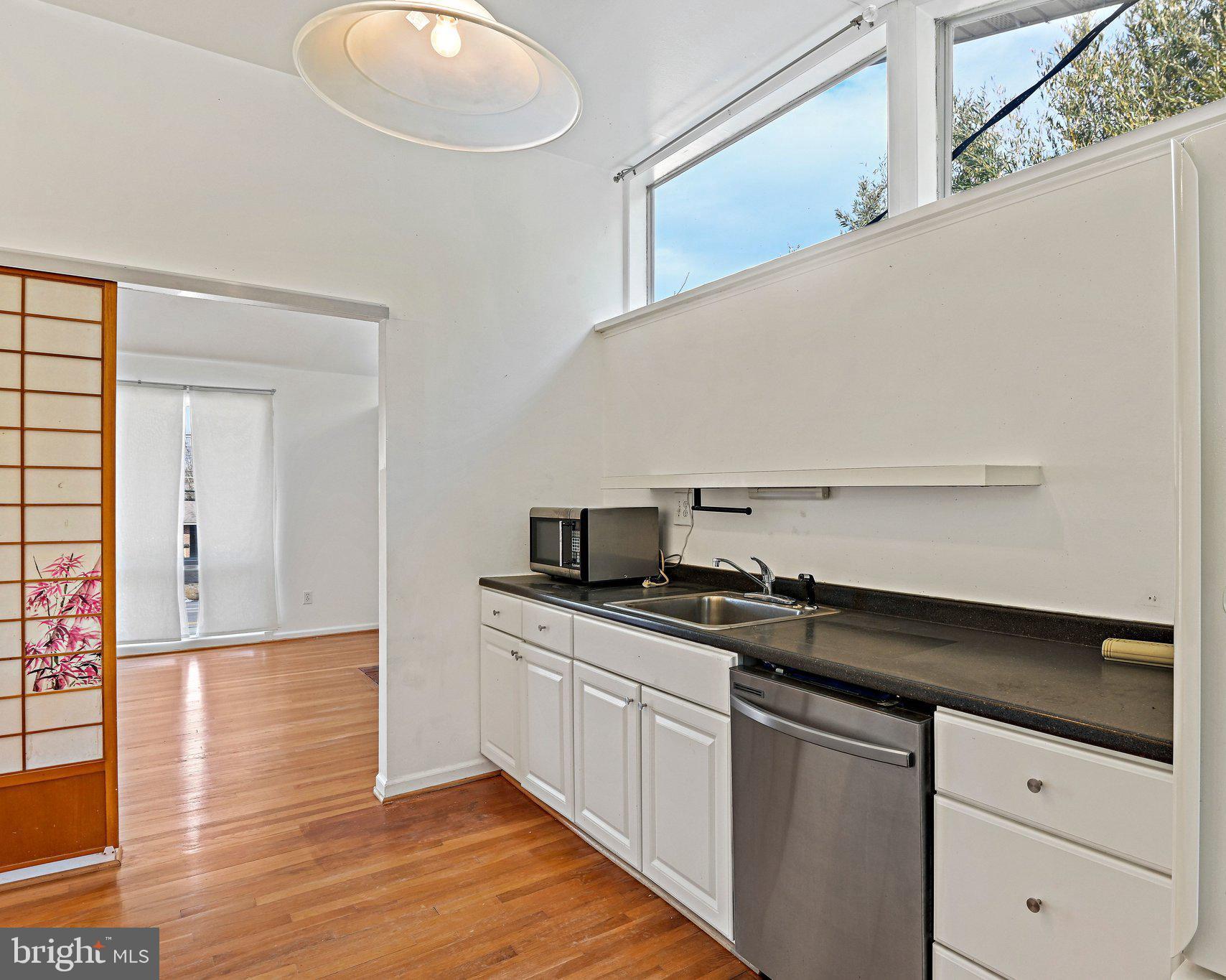 6713 Old Chesterbrook Road McLean, VA 22101 - Photo 21 of 38 a kitchen with a sink a stove and cabinets