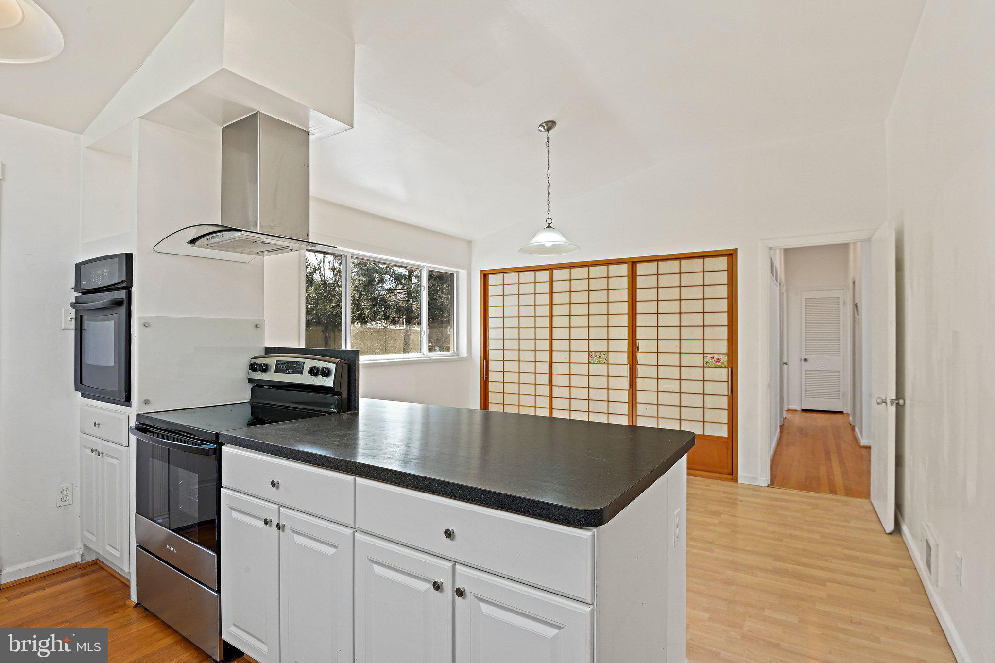 6713 Old Chesterbrook Road McLean, VA 22101 - Photo 22 of 38 a kitchen with granite countertop a sink appliances and cabinets