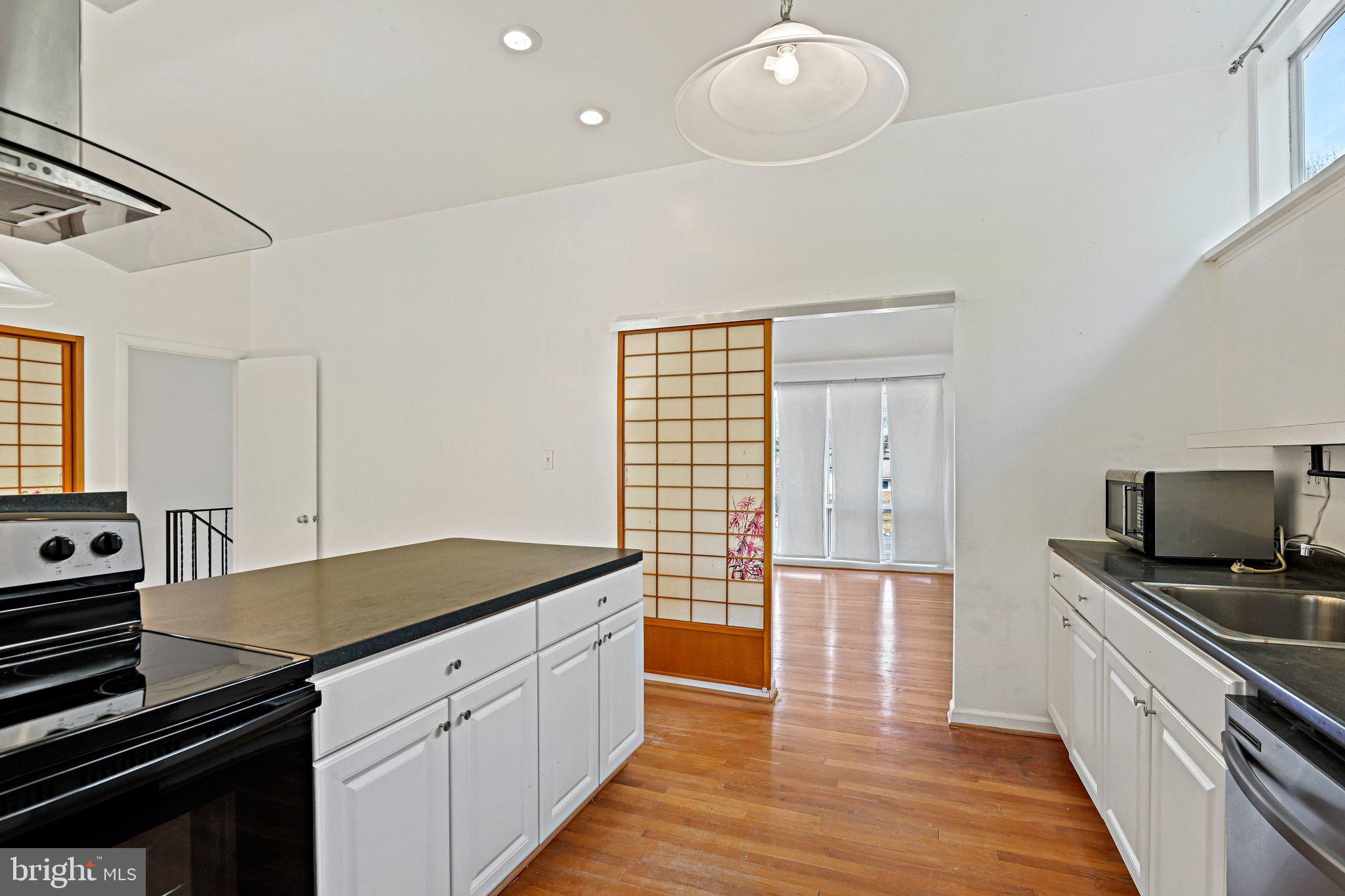 6713 Old Chesterbrook Road McLean, VA 22101 - Photo 23 of 38 a kitchen with a sink appliances and cabinets