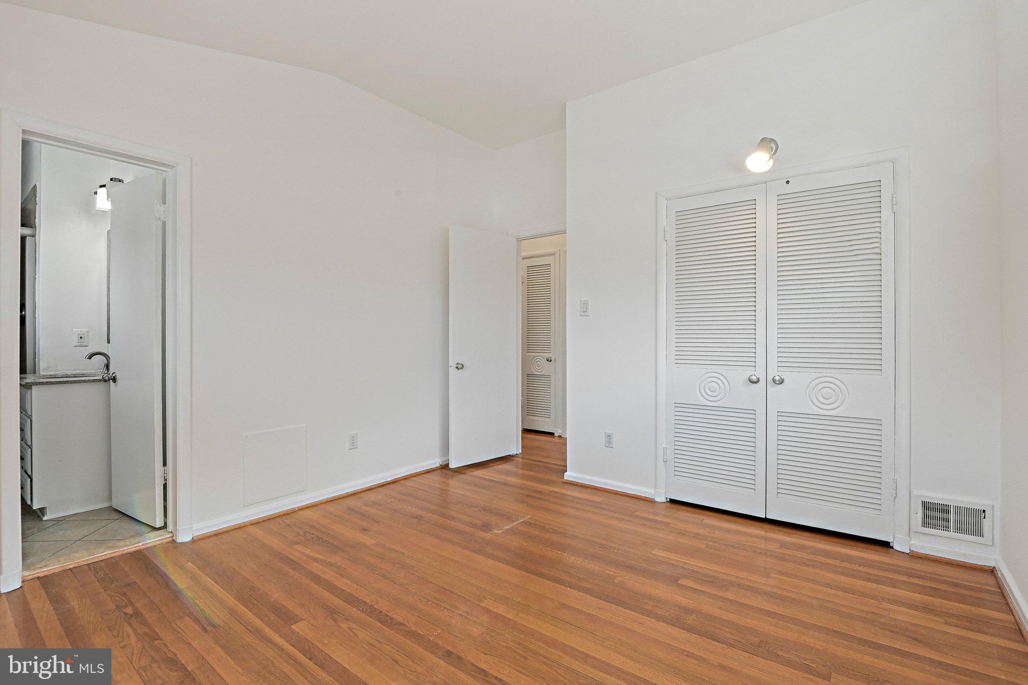 6713 Old Chesterbrook Road McLean, VA 22101 - Photo 29 of 38 wooden floor in an empty room with wooden floor