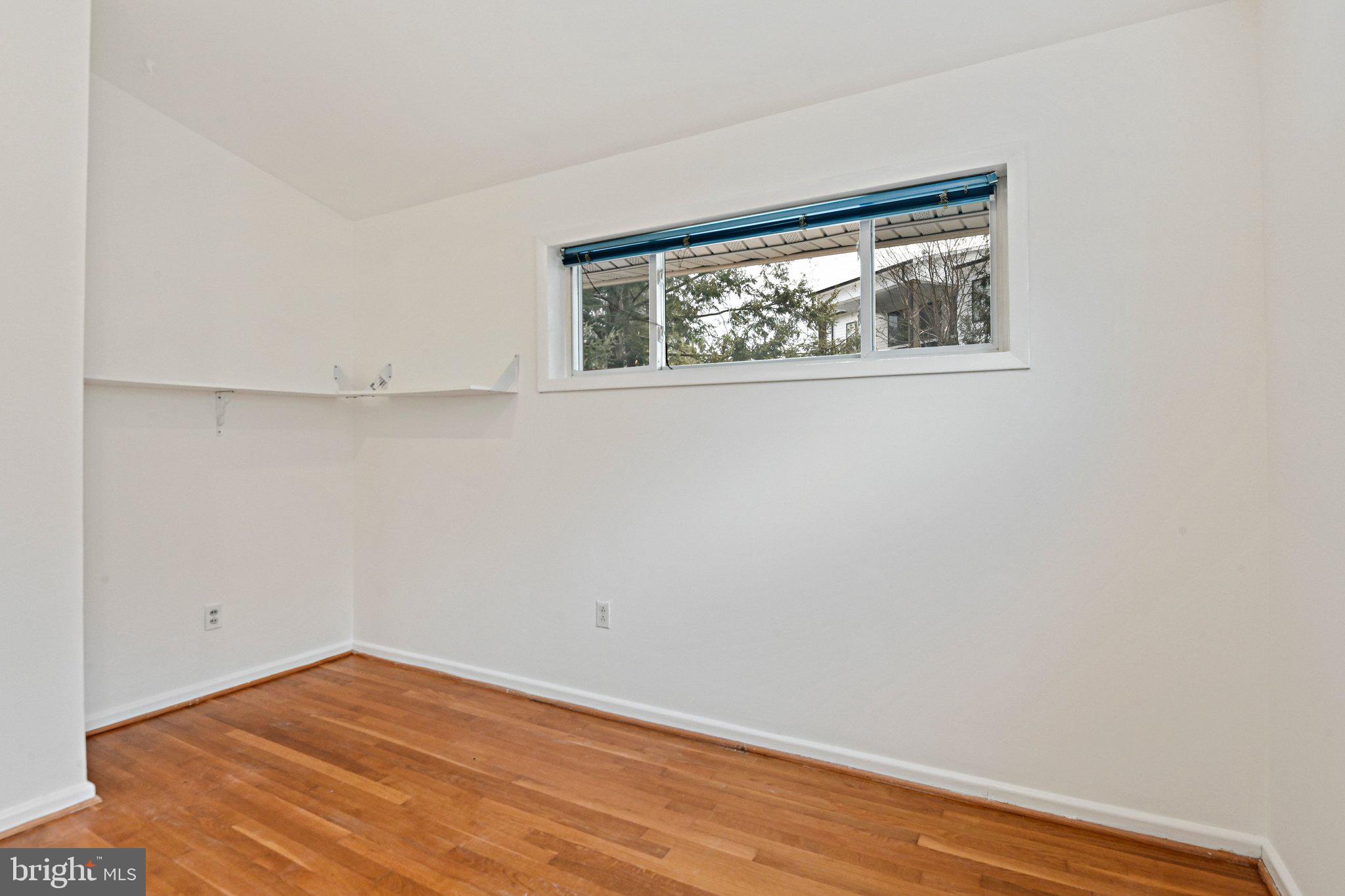 6713 Old Chesterbrook Road McLean, VA 22101 - Photo 35 of 38 a view of empty room with wooden floor and fan