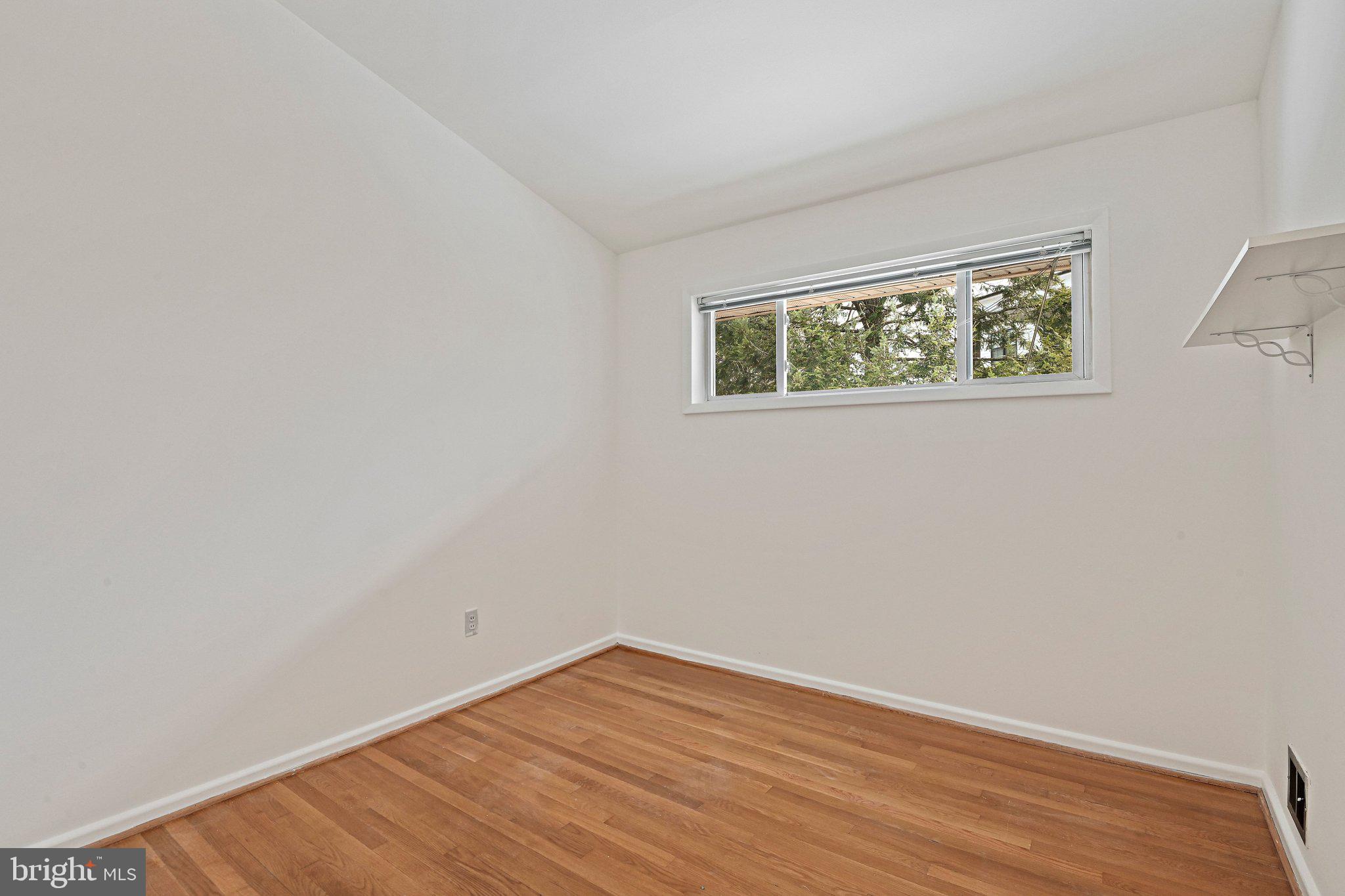 6713 Old Chesterbrook Road McLean, VA 22101 - Photo 36 of 38 an empty room with wooden floor and window