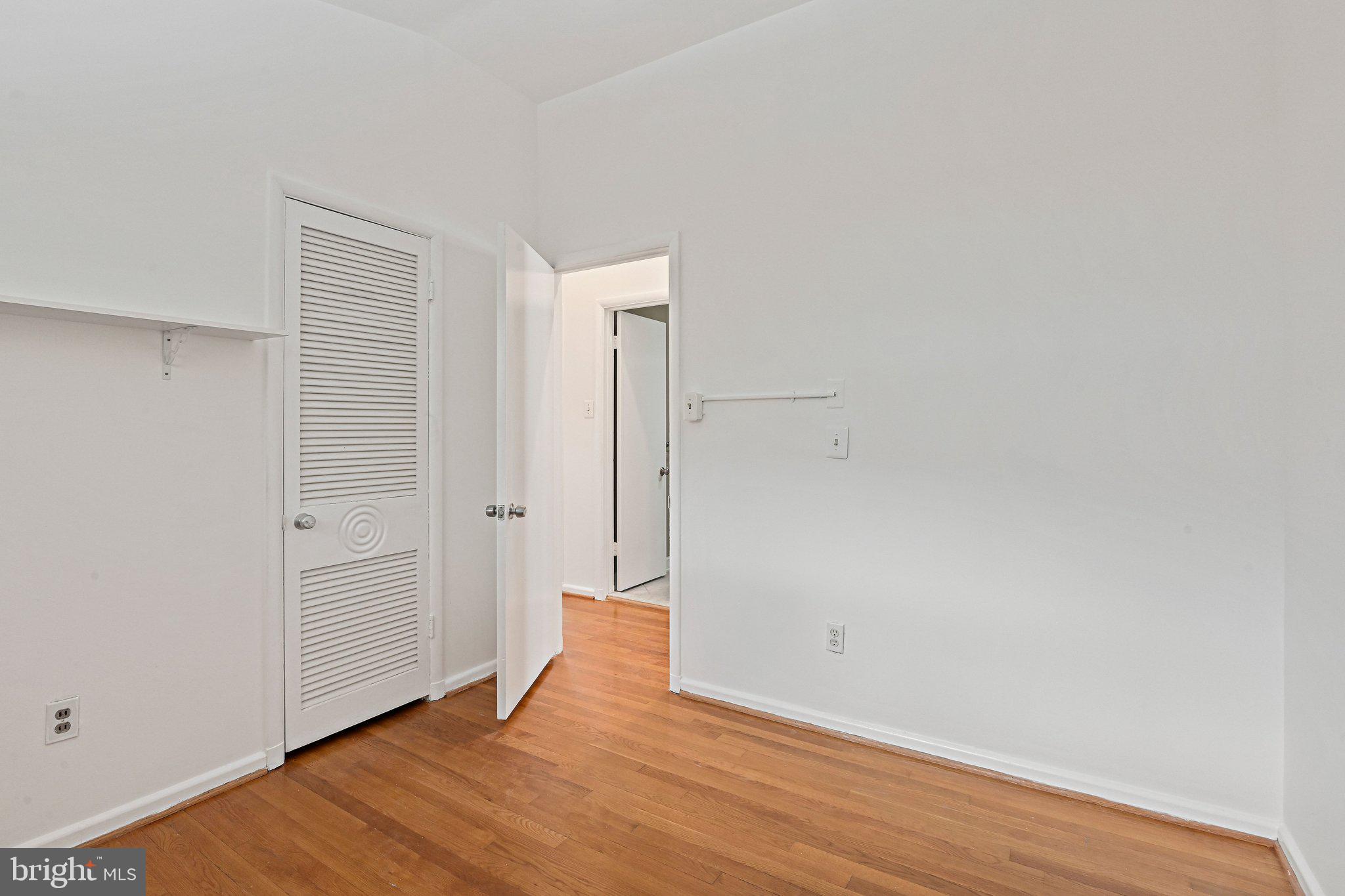 6713 Old Chesterbrook Road McLean, VA 22101 - Photo 37 of 38 a view of an empty room with wooden floor and closet