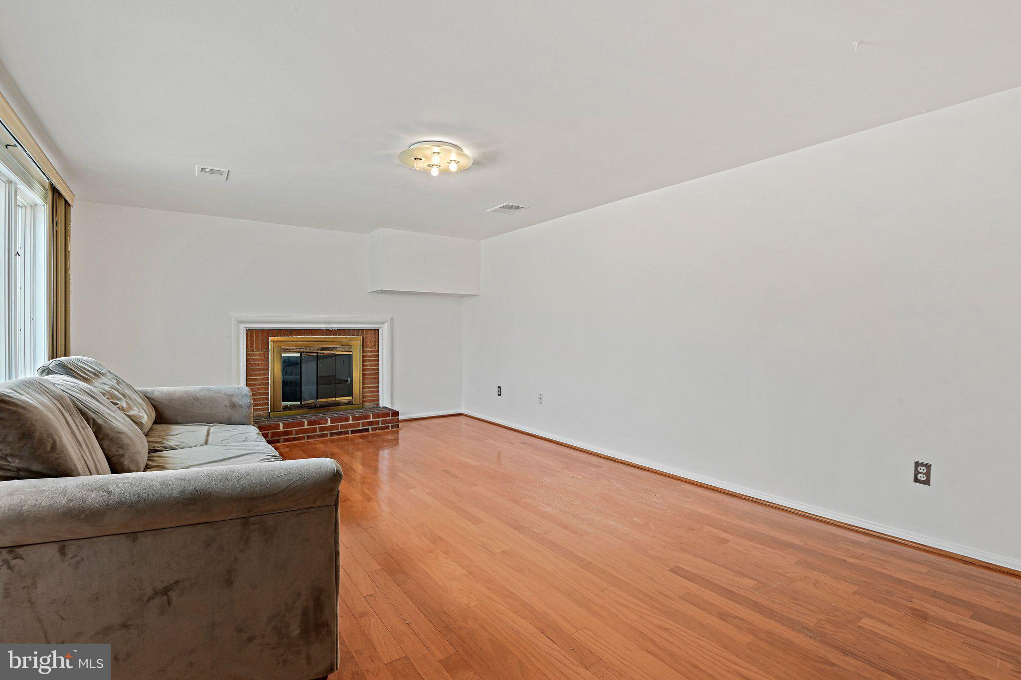 6713 Old Chesterbrook Road McLean, VA 22101 - Photo 6 of 38 a living room with furniture and a fireplace