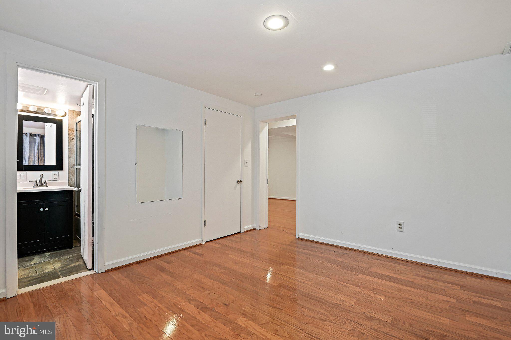 6713 Old Chesterbrook Road McLean, VA 22101 - Photo 7 of 38 an empty room with wooden floor and windows