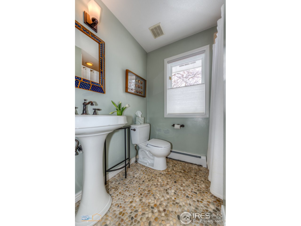 4669 Apple Way Boulder, CO 80301 - Photo 13 of 25 a bathroom with a toilet a sink and a mirror